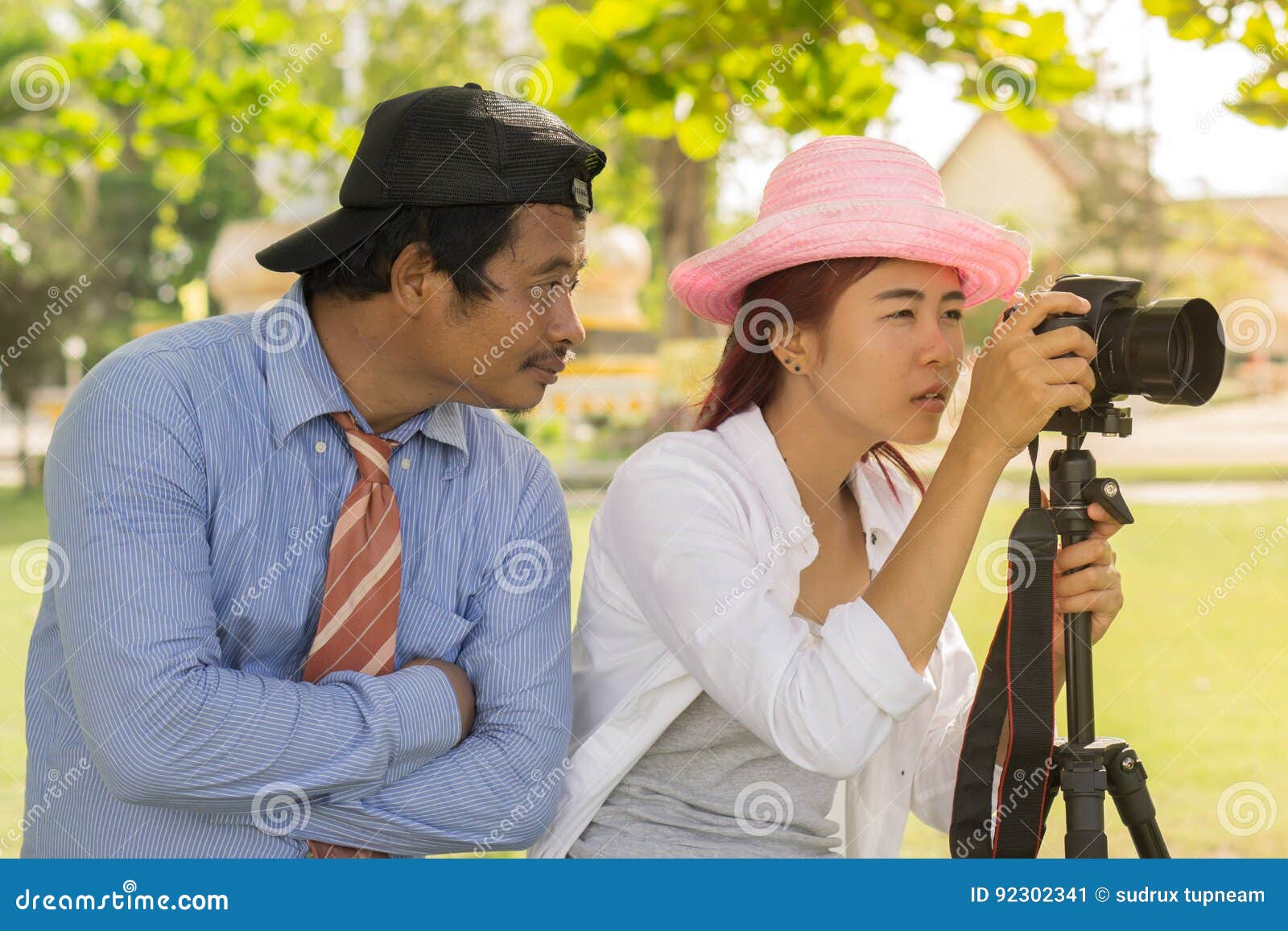 Asian Teen is an Amateur Photographer Practicing Phot