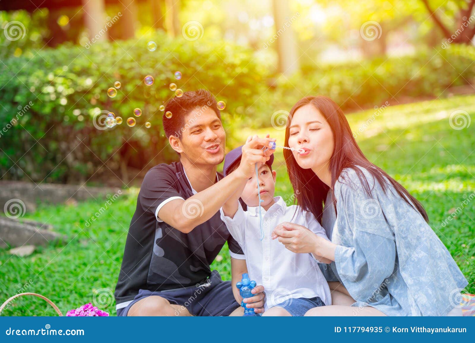 asian teen family one kid happy holiday picnic moment in the park