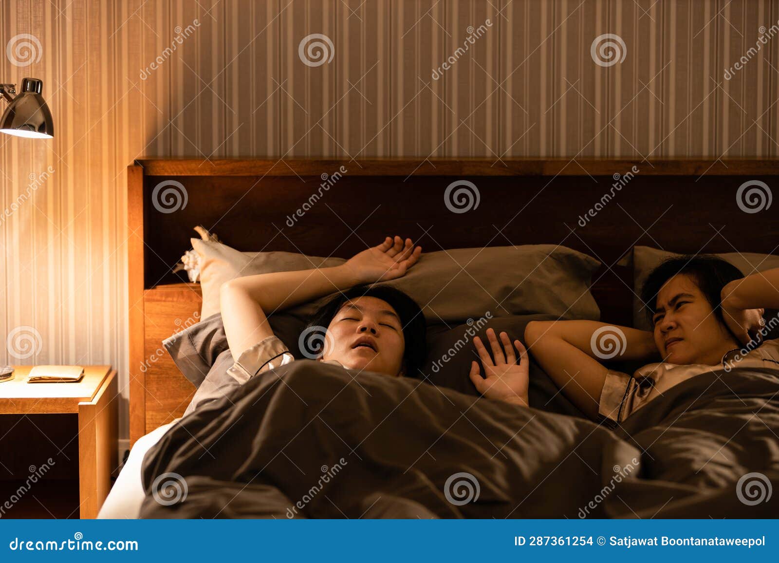 asian teenage girl snoring in bed having chronic nasal congestion,symptom of obstructive sleep apnea,making a snorting or grunting