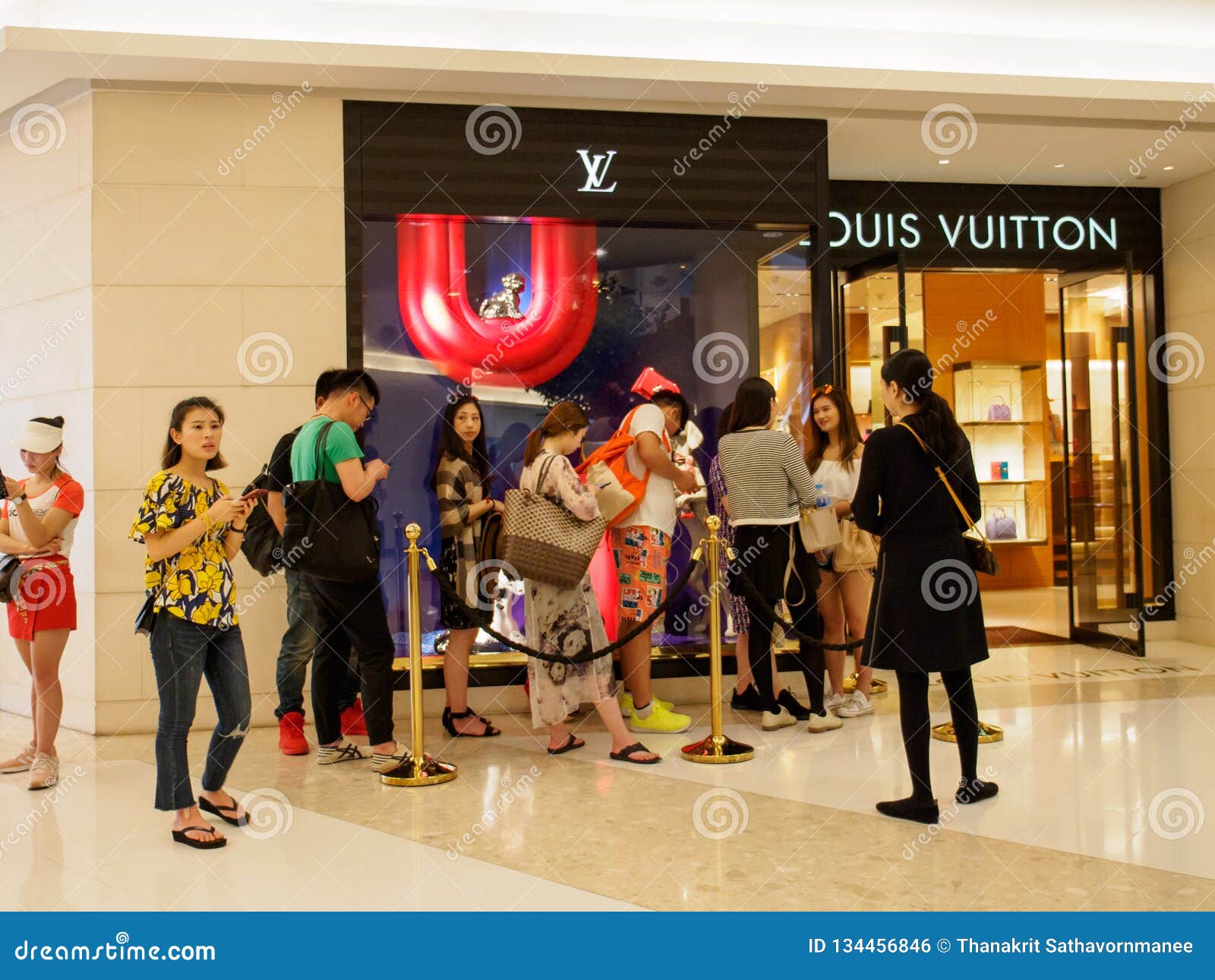 Asian Tourists Queue at Louis Vuitton Boutique, Bangkok, Thailand