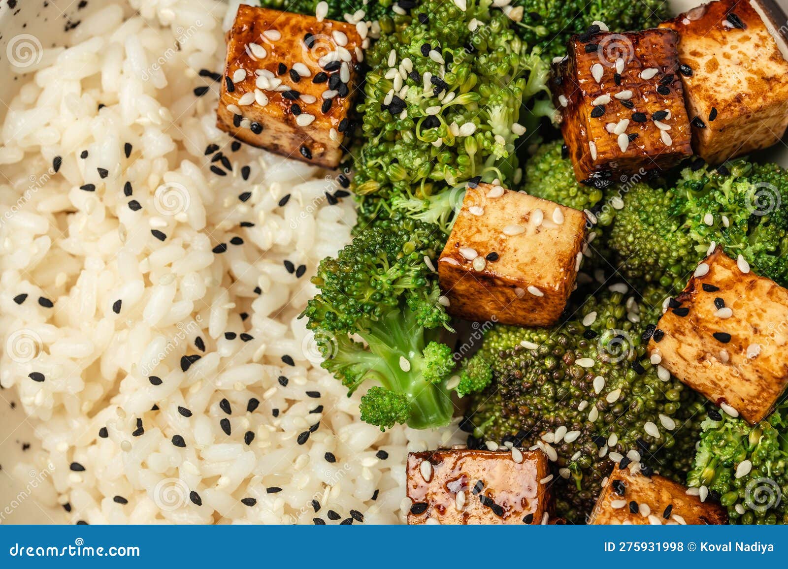 Asian Vegan Bowl with Rice, Broccoli and Fried Tofu. Top View Stock