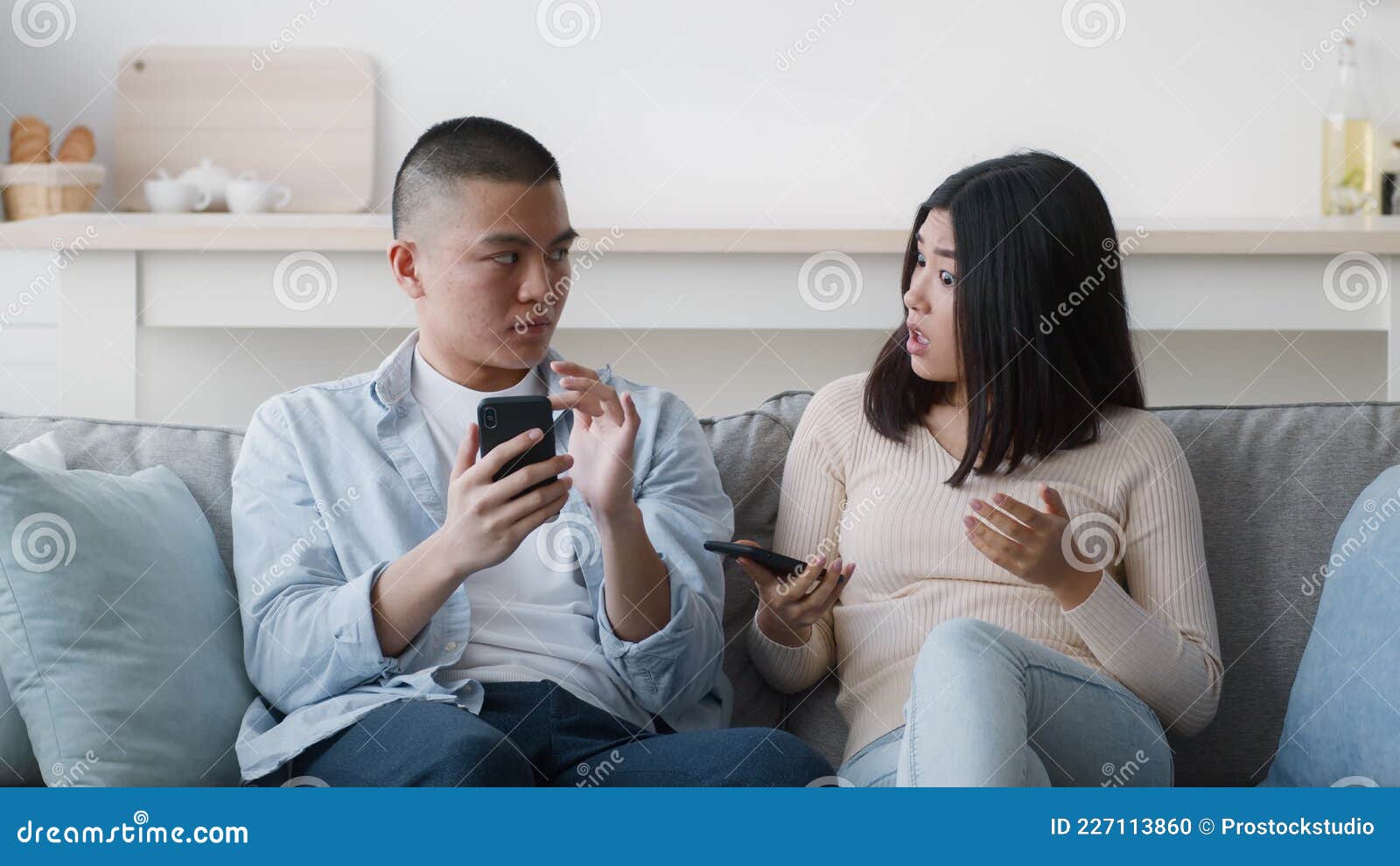 Asian Wife Catching Cheating Husband on Texting with Lover Indoor Stock Footage