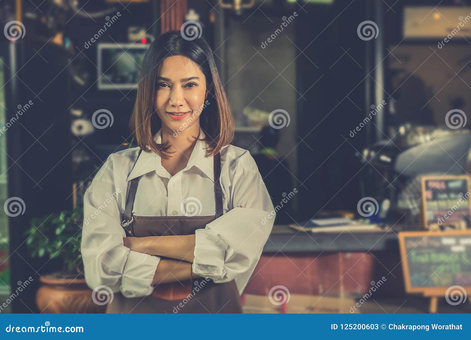 asian woman barista successful small business owner standing in