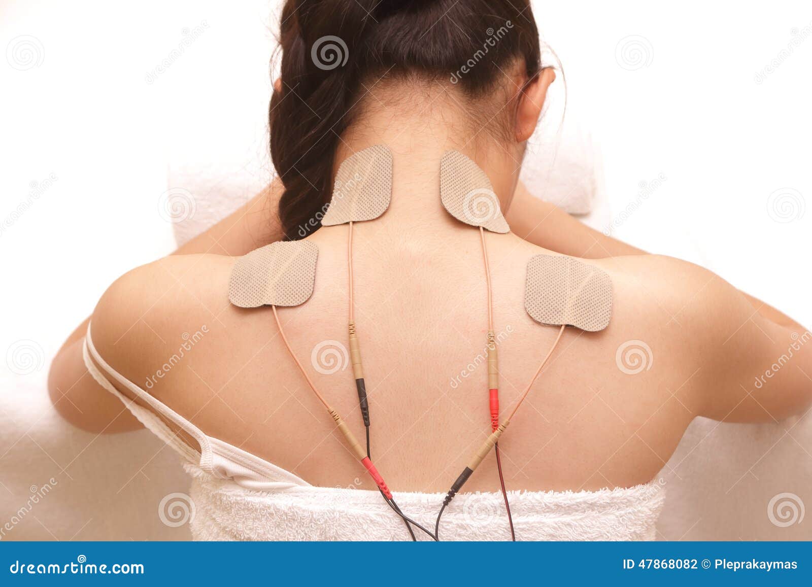 asian woman is doing massage of electrical -stimulation ( tens )