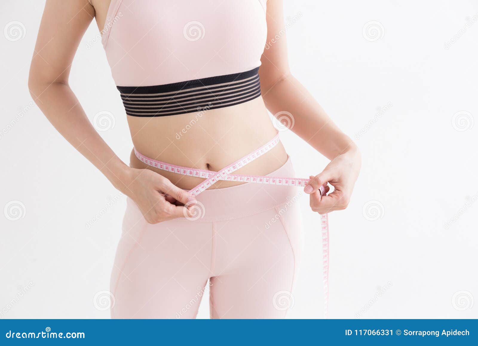 asian woman with measure tape in her hand to measure herself,healthy lifestyles concept of body