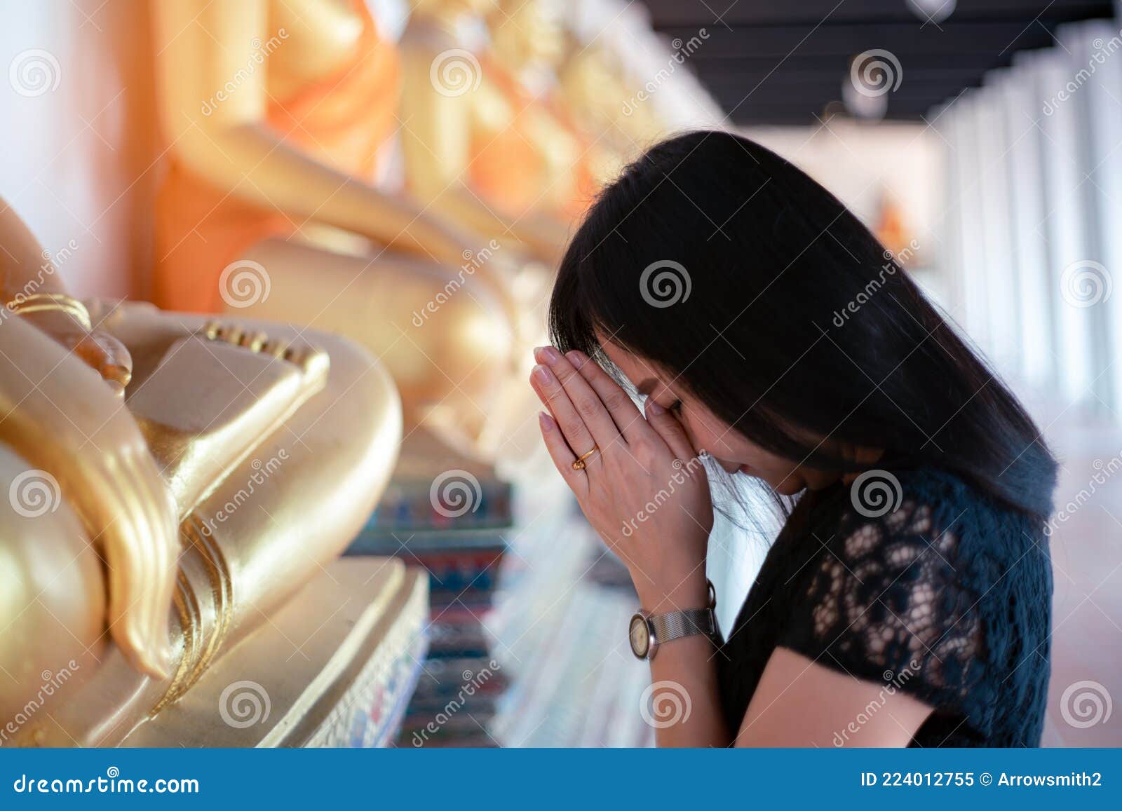 Asian Woman Pays Homage To The Buddha Statue With Respect And Faith Stock Image Image Of