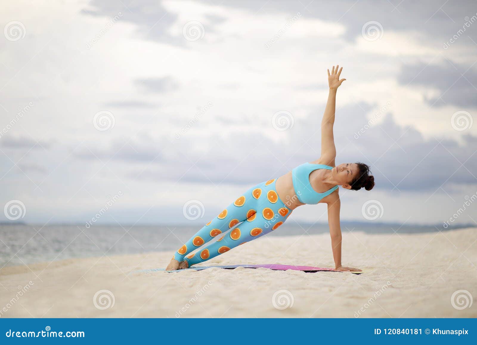 Beautiful sporty fit yogi woman practices yoga asana Matsyasana - fish pose  variation in the beach. Stretching exercise, working out, wearing  sportswear, full length, side view. Stock Photo | Adobe Stock