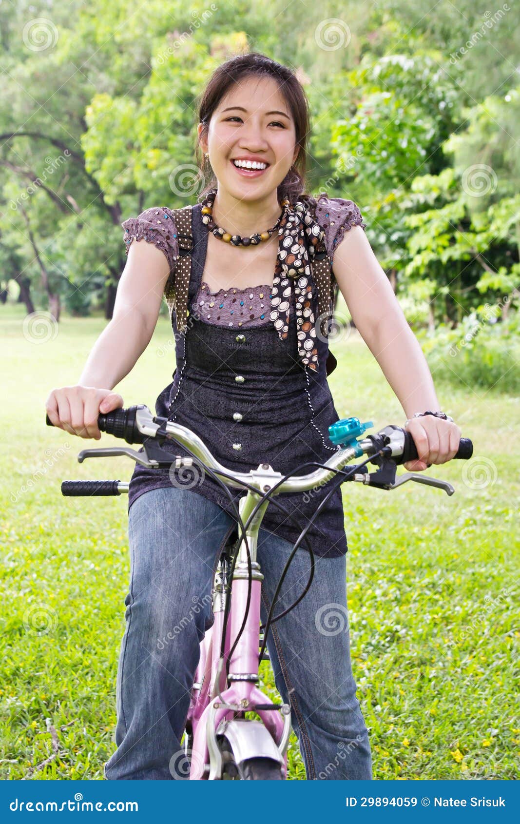 Asian woman riding bicycle stock image. Image of park 29894059