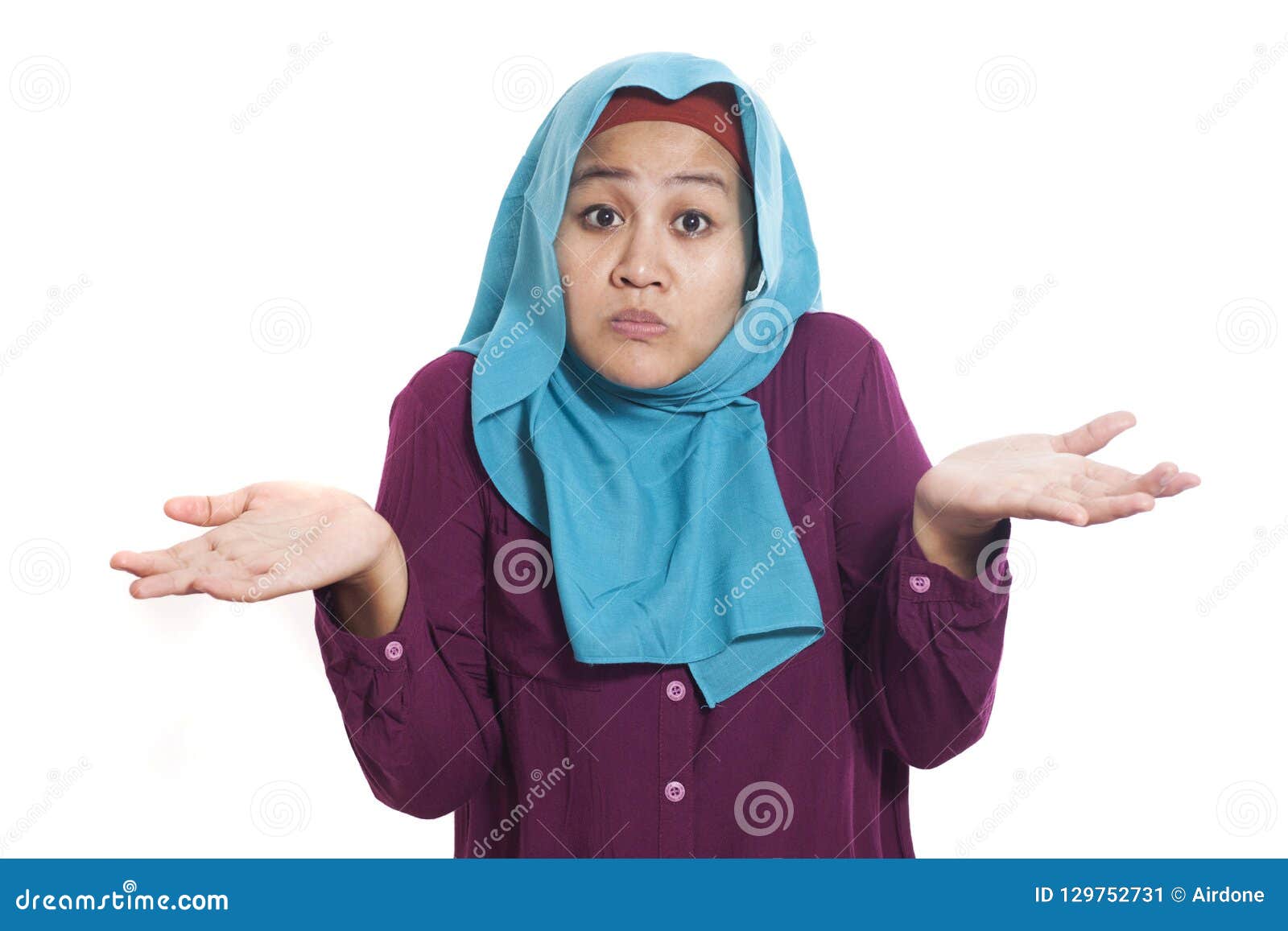 asian woman shrugging shoulder, i don`t know gesture