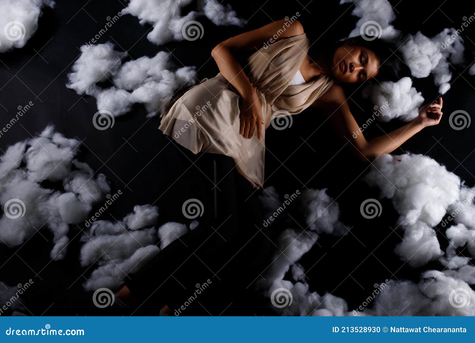 Asian Woman Sleep on Scatter Fake Cloud at Night Sky Time Stock