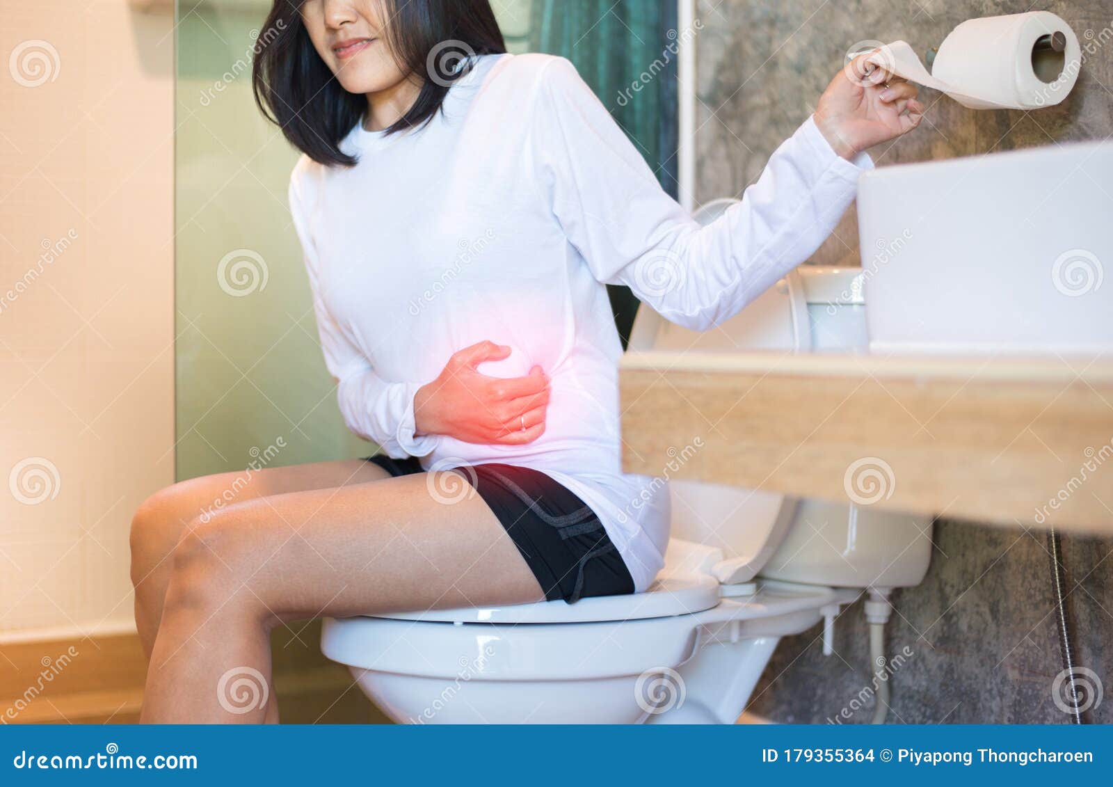 Asian Woman Sufferring With Hemorrhoids Or Constipation In Toil