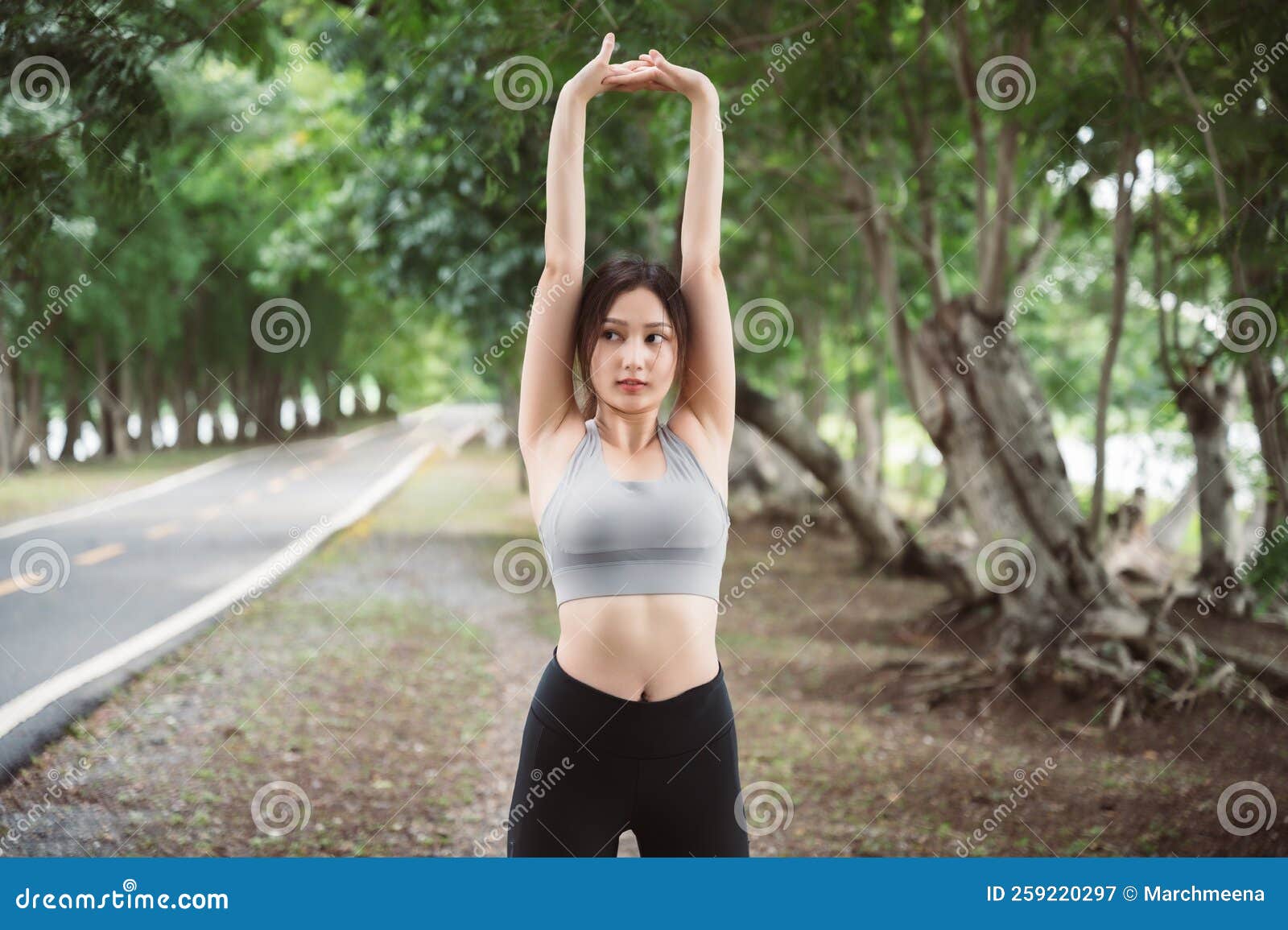 Asian Woman Trainer is Engaged in Fitness in Public Park Stock Image ...