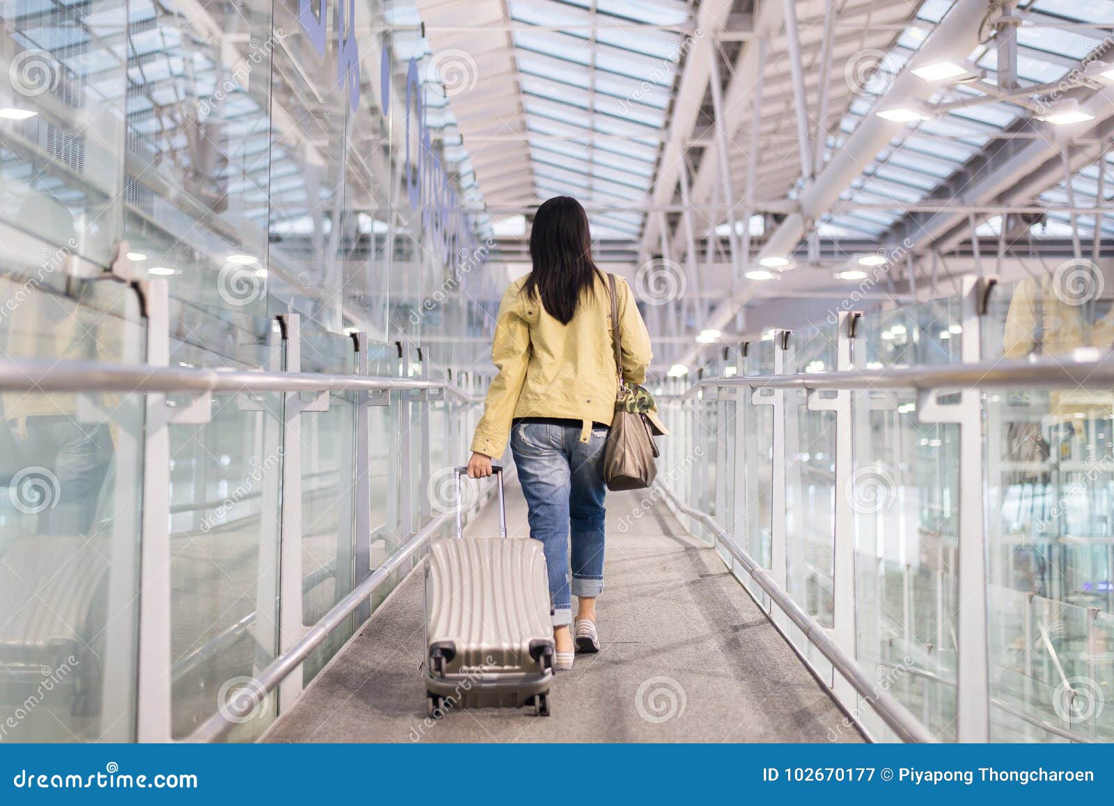 Travel Woman Walking In An Airport With A Luggage Baggage Carry-on