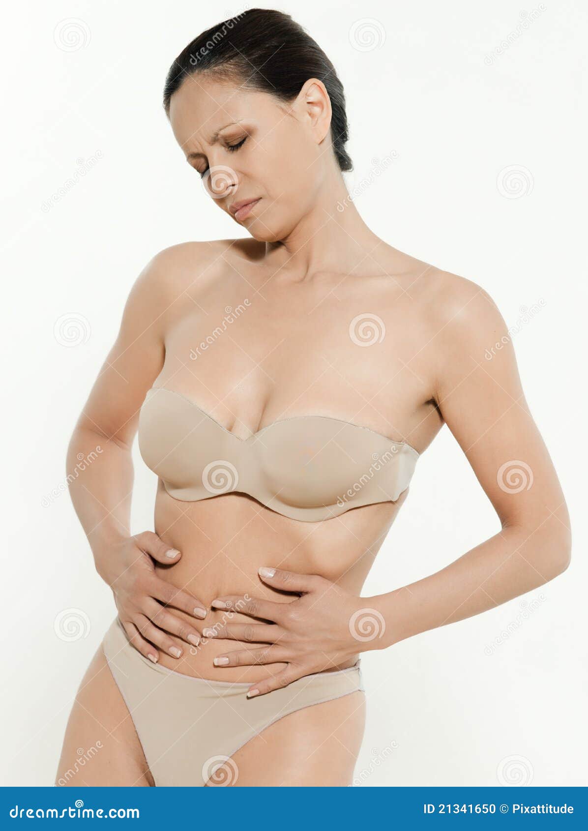Asian Woman in Undergarments Having Period Pain Stock Photo