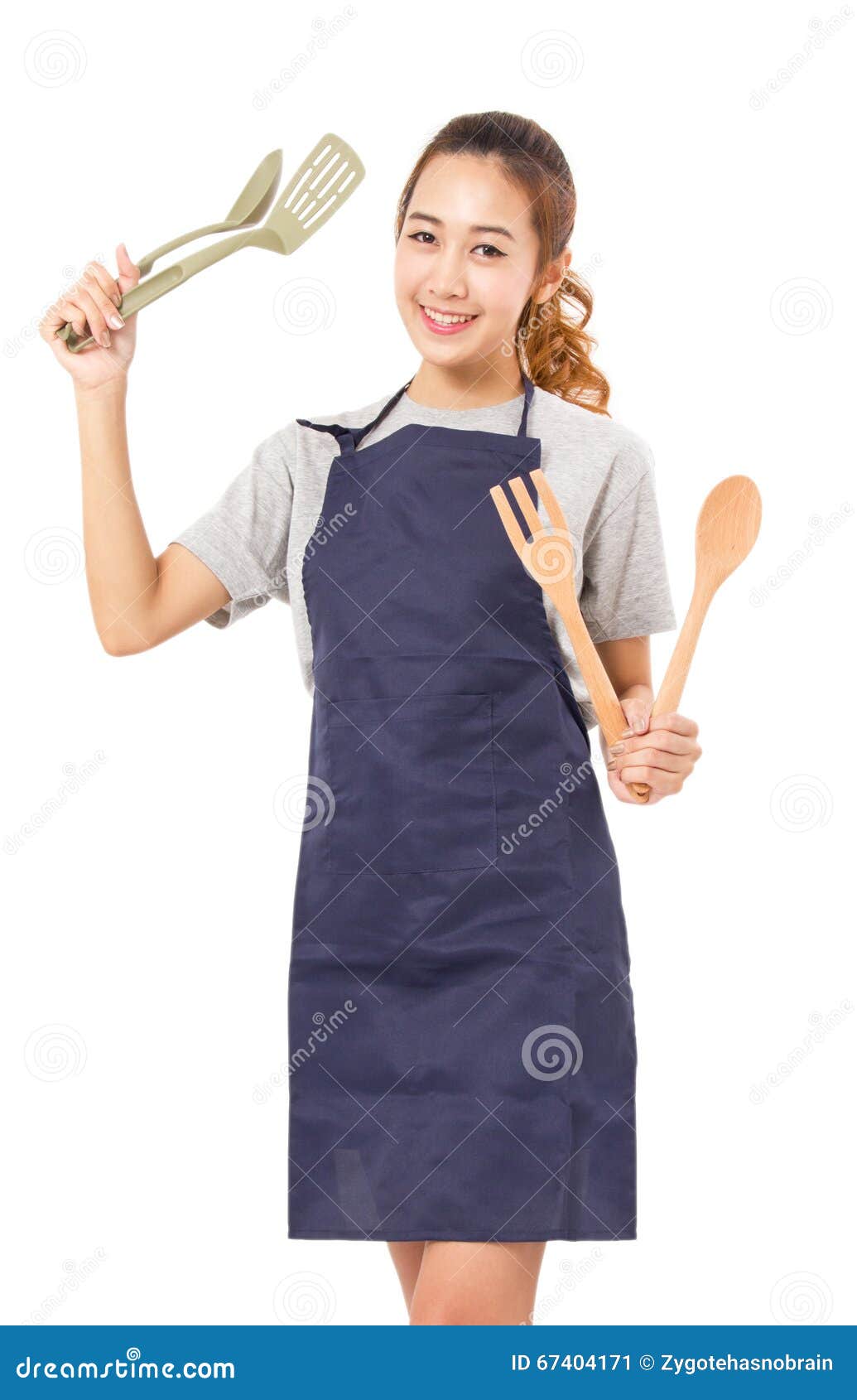 asian woman wearing apron and showing cooking tools.