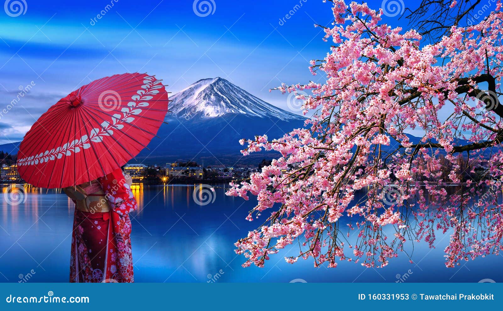 asian woman wearing japanese traditional kimono at fuji mountain and cherry blossom, kawaguchiko lake in japan