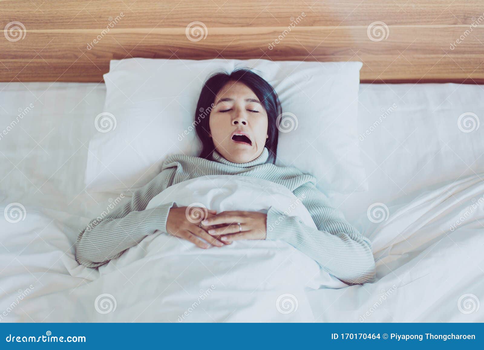 asian woman yawning on her bedroom and tired sleepy,symptoms and sleepiness