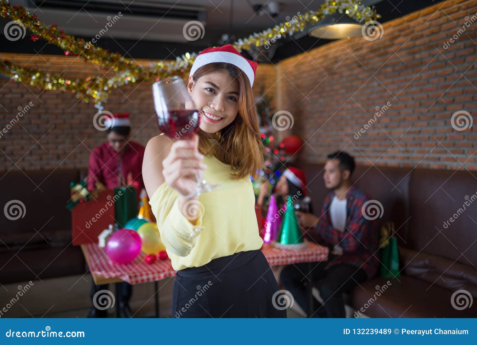 Asian Woman Holding a Glass of Champagne at the Party. Concept of ...