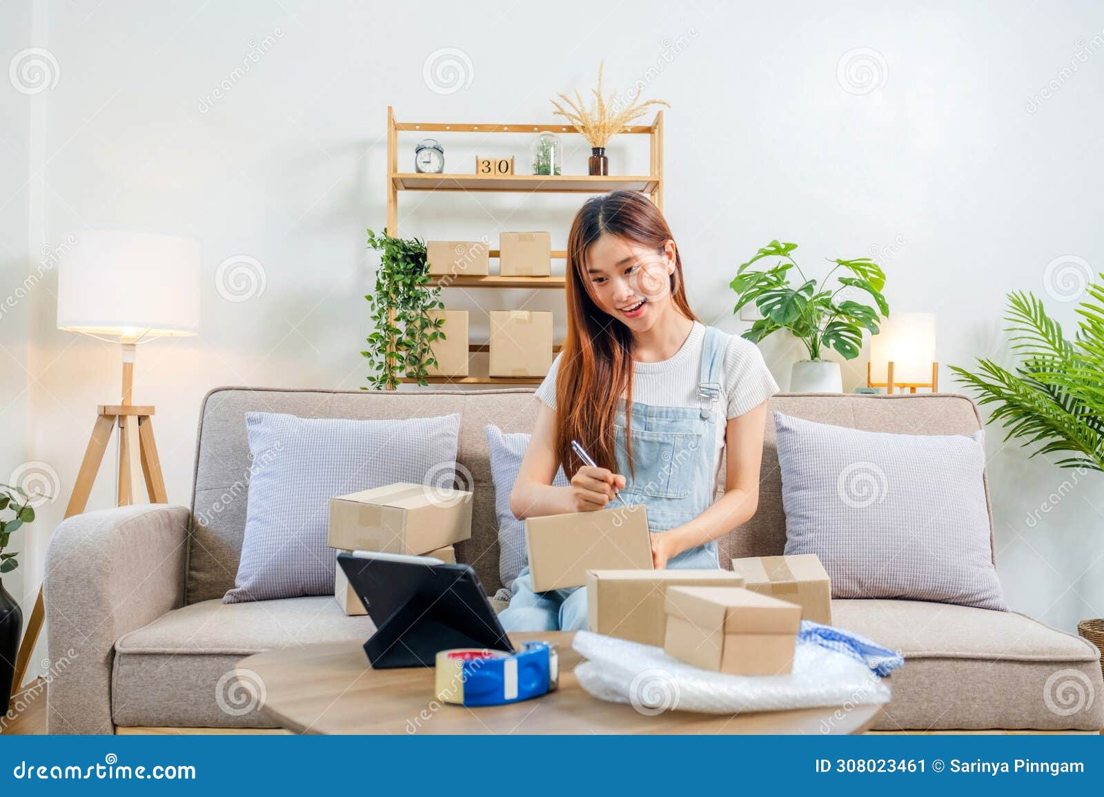 asian women sme freelance working with packaging startup entrepreneur small business owner at home,online business seller
