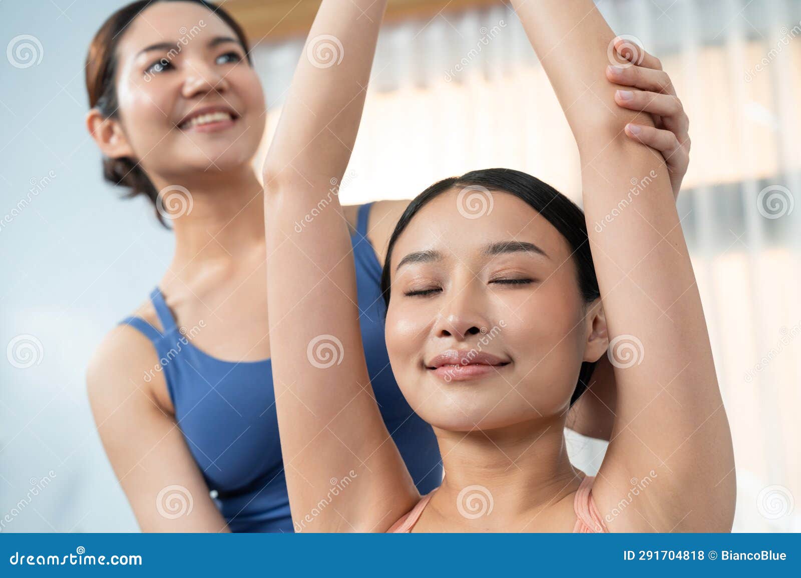 Asian Woman Doing Yoga Exercise on Fitness Mat with Trainer. Vigorous Stock  Photo - Image of home, energy: 291704818