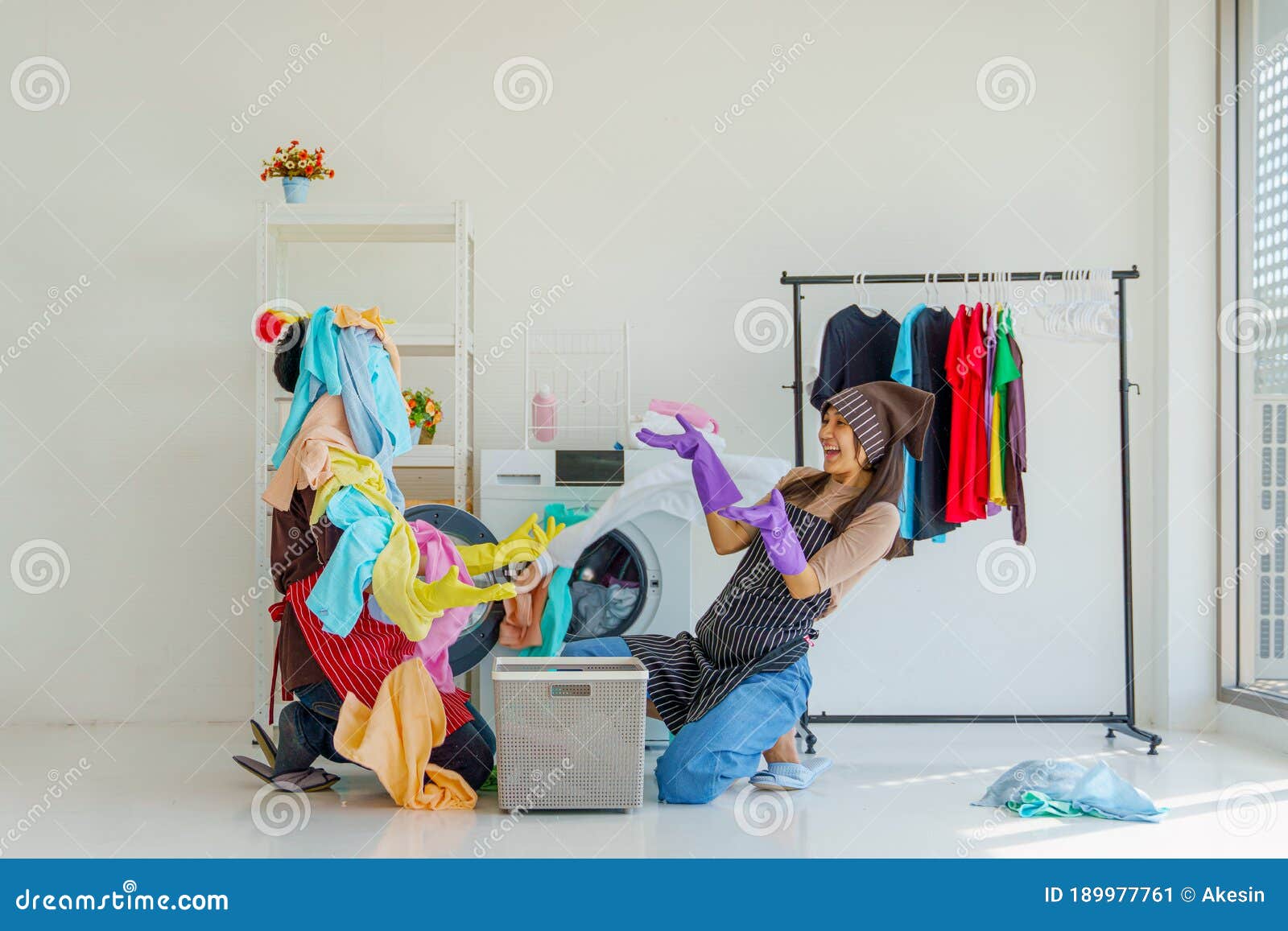Husband and Wife Have Fun Do Housework and Housekeeping Togethe image