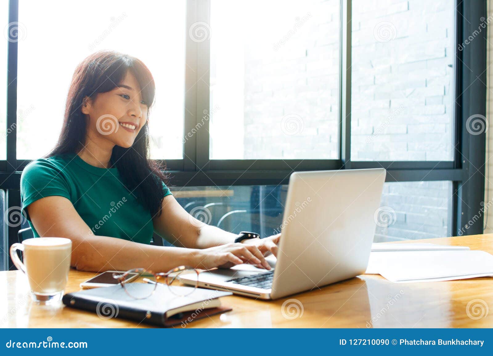 asian young owner business woman working online, checking mail on laptop organizing working process in office. copy space.