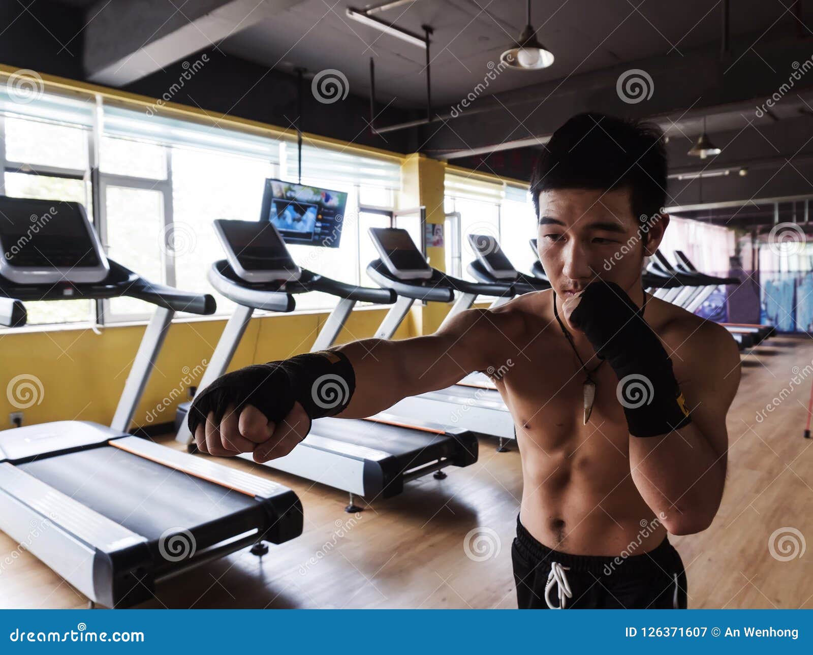 asians man boxing at gym