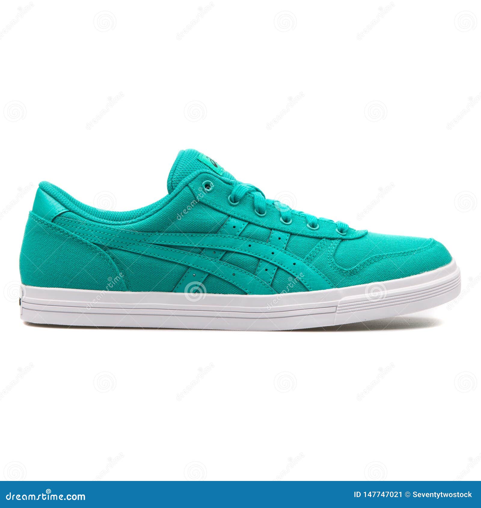 Asics green sneaker editorial photo. Image of color
