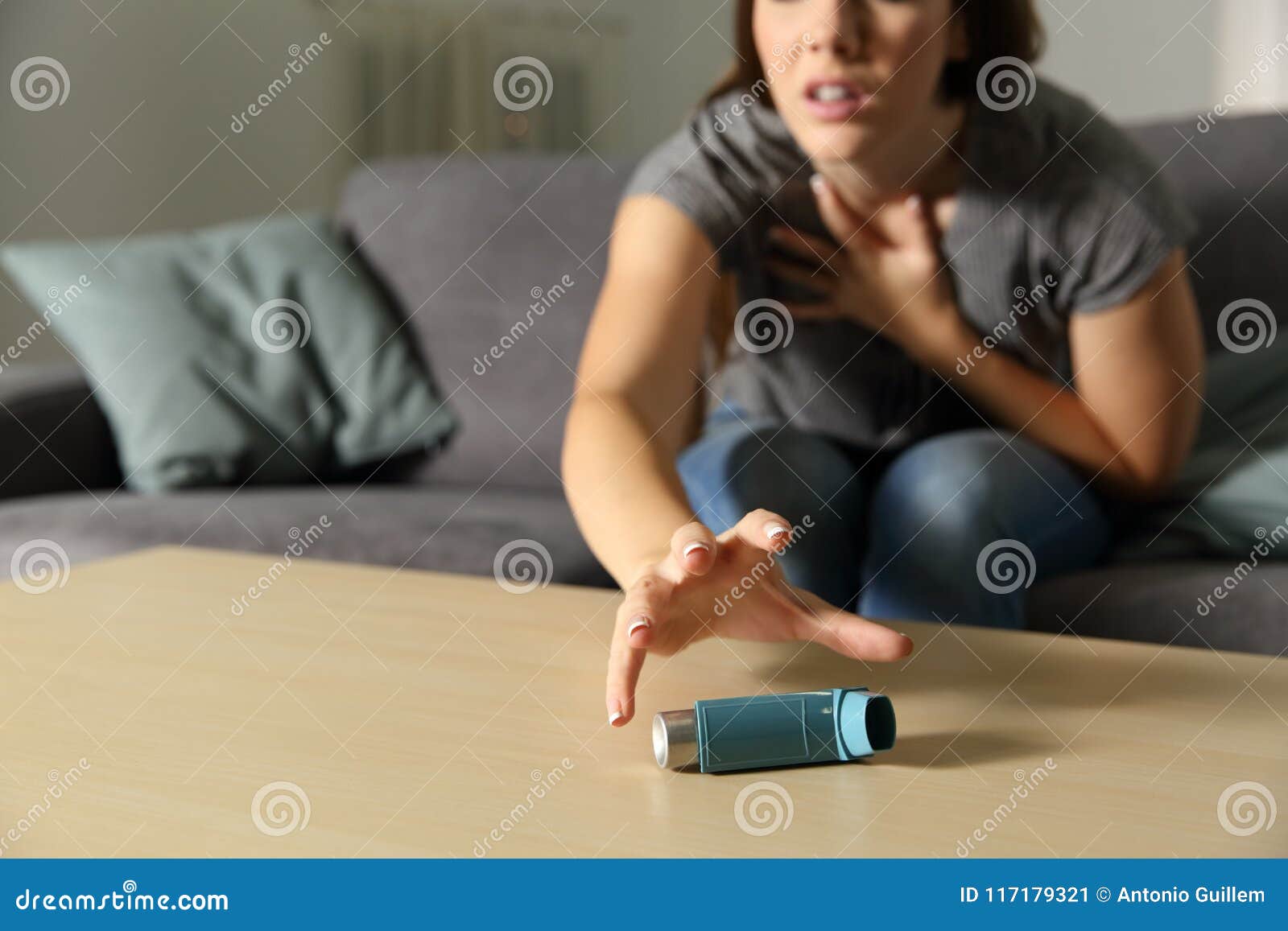 asmathic girl catching inhaler having an asthma attack