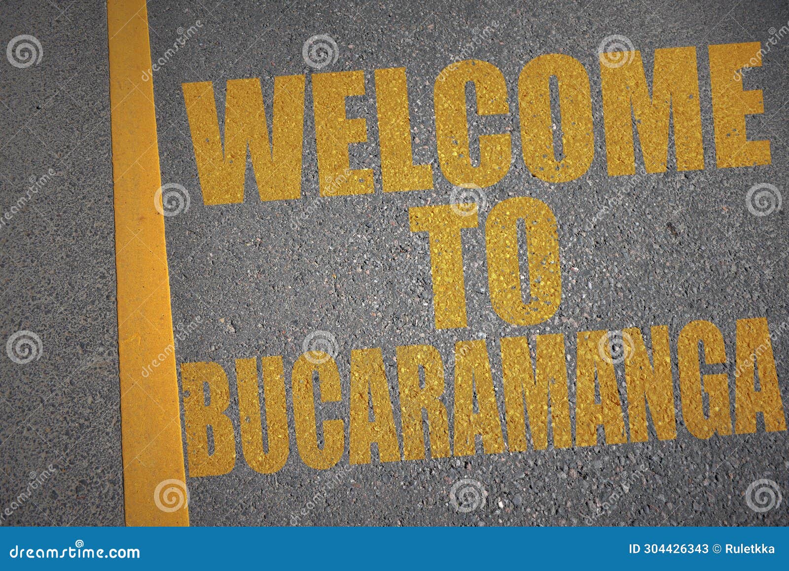 asphalt road with text welcome to bucaramanga near yellow line