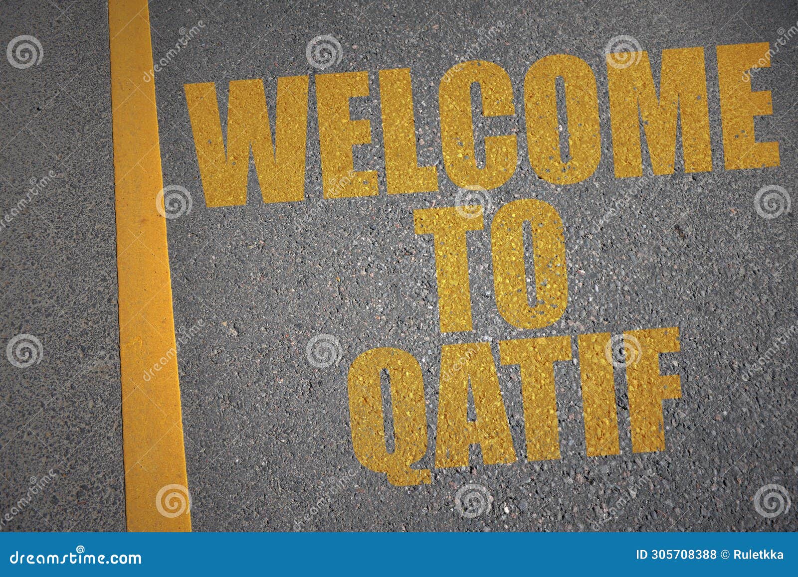 asphalt road with text welcome to qatif near yellow line