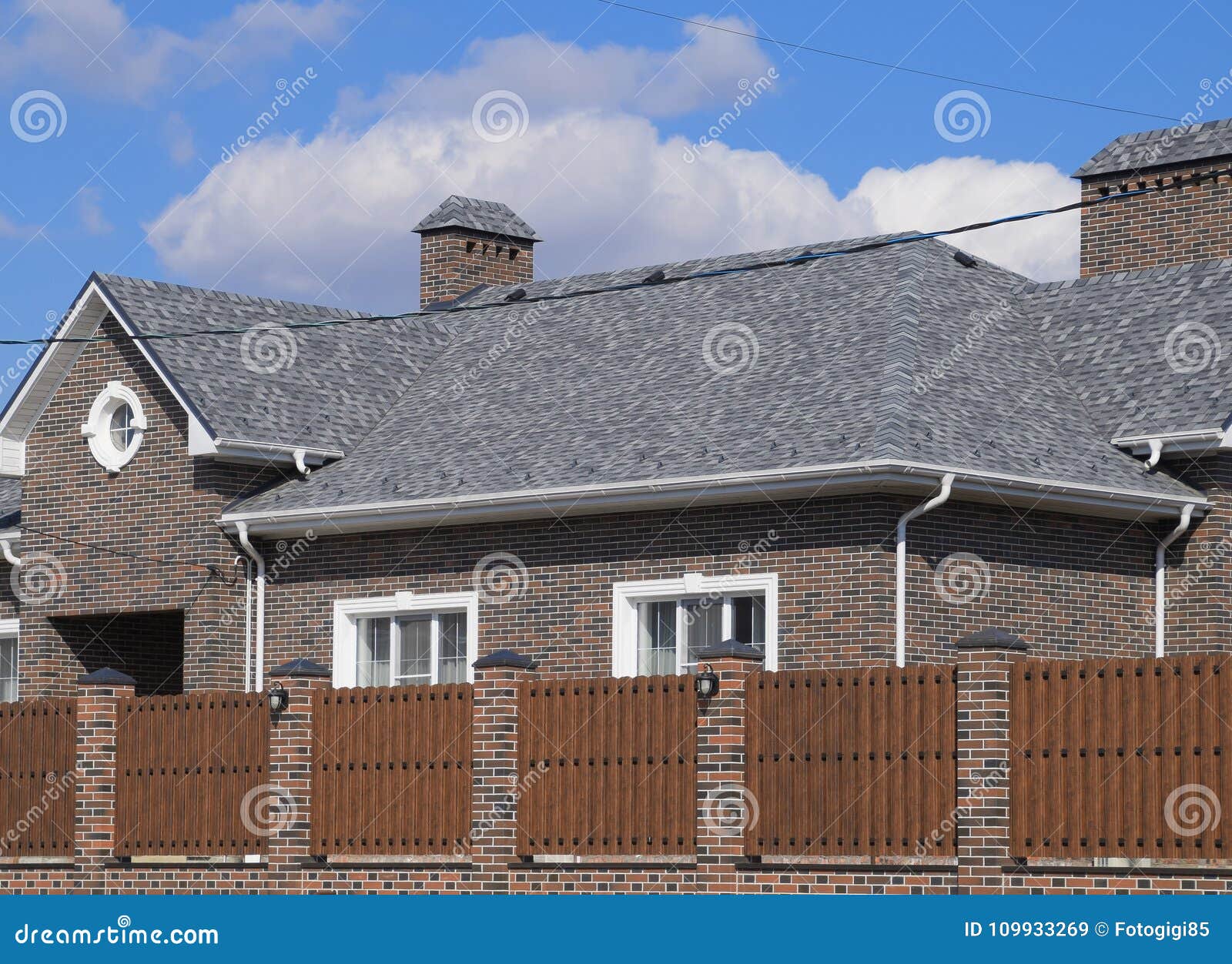 Asphalt Shingle Decorative Bitumen Shingles On The Roof Of A