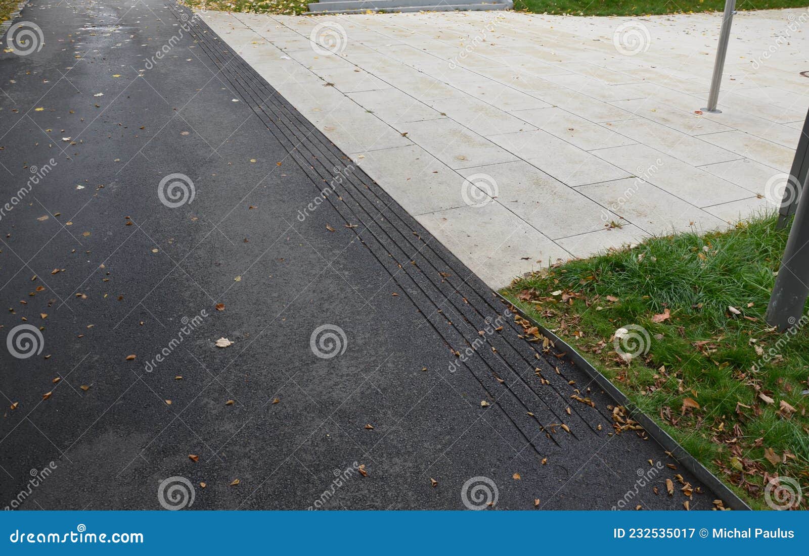 Asphalt Street Surface with Grooves for the Blind. the Sidewalk Has ...