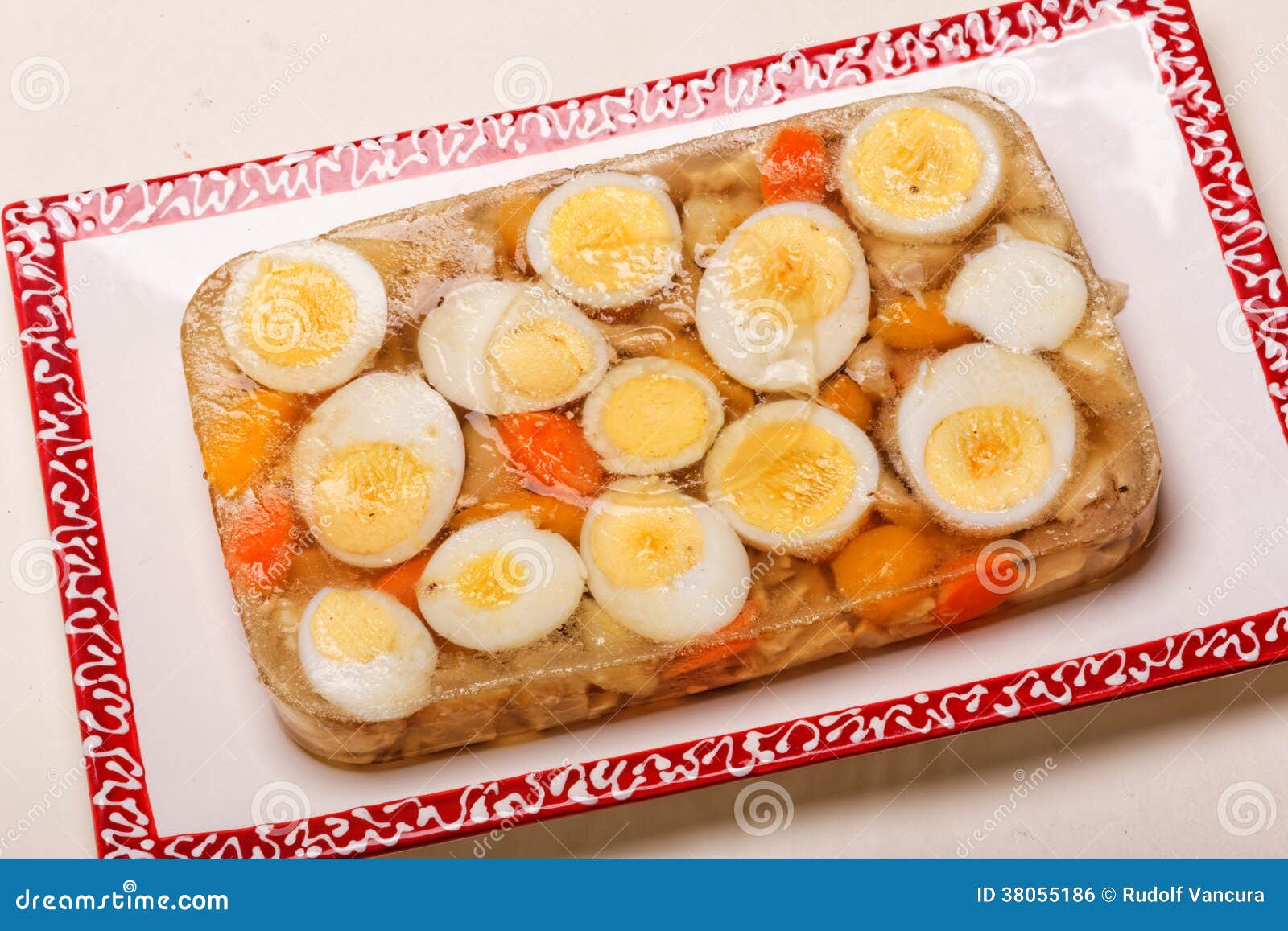 aspic of boiled eggs and chicken on plate