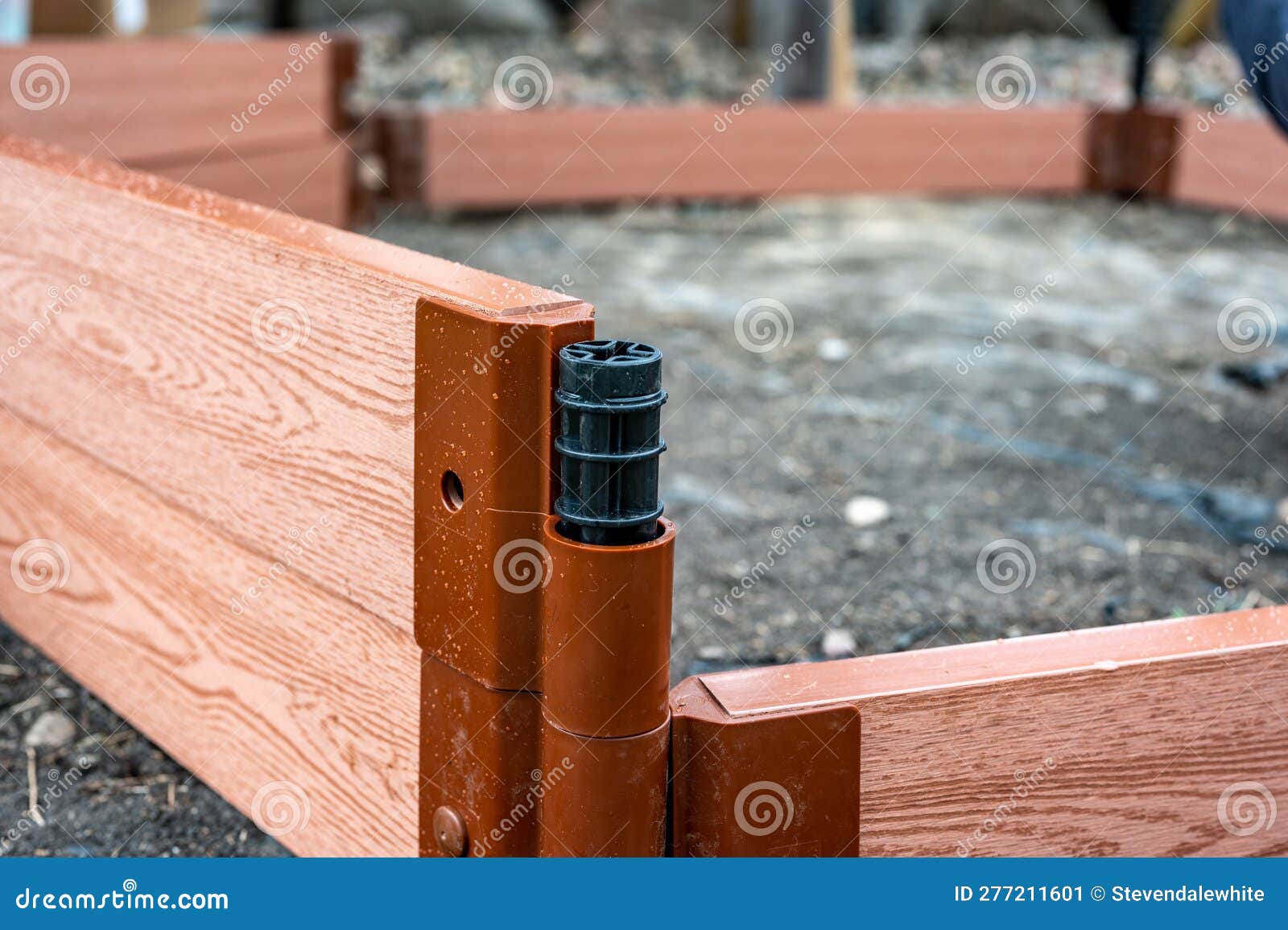 Assembling a Raised Bed Garden Panel with Plastic Connectors Stock