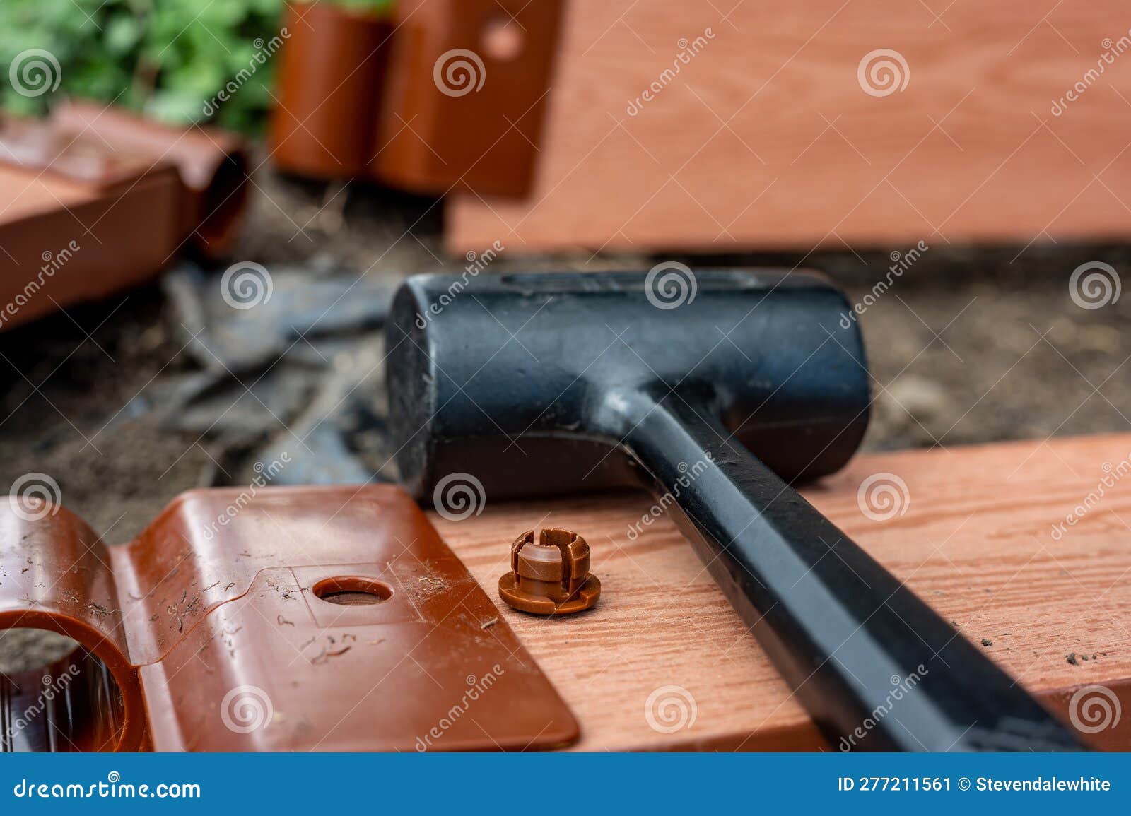 Assembling a Raised Bed Garden Panel with Plastic Connectors Using a