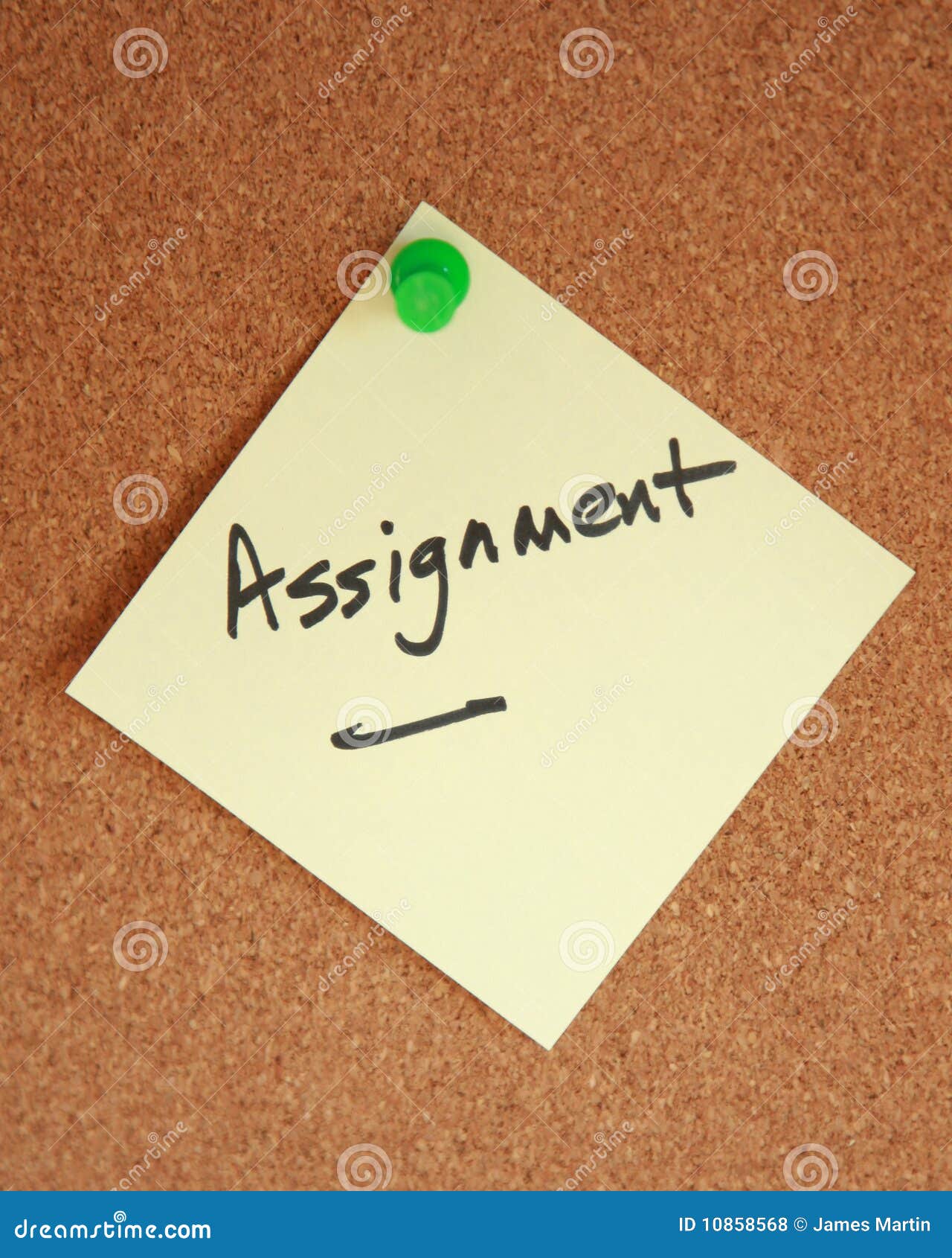 assignment witten on note stuck to corkboard