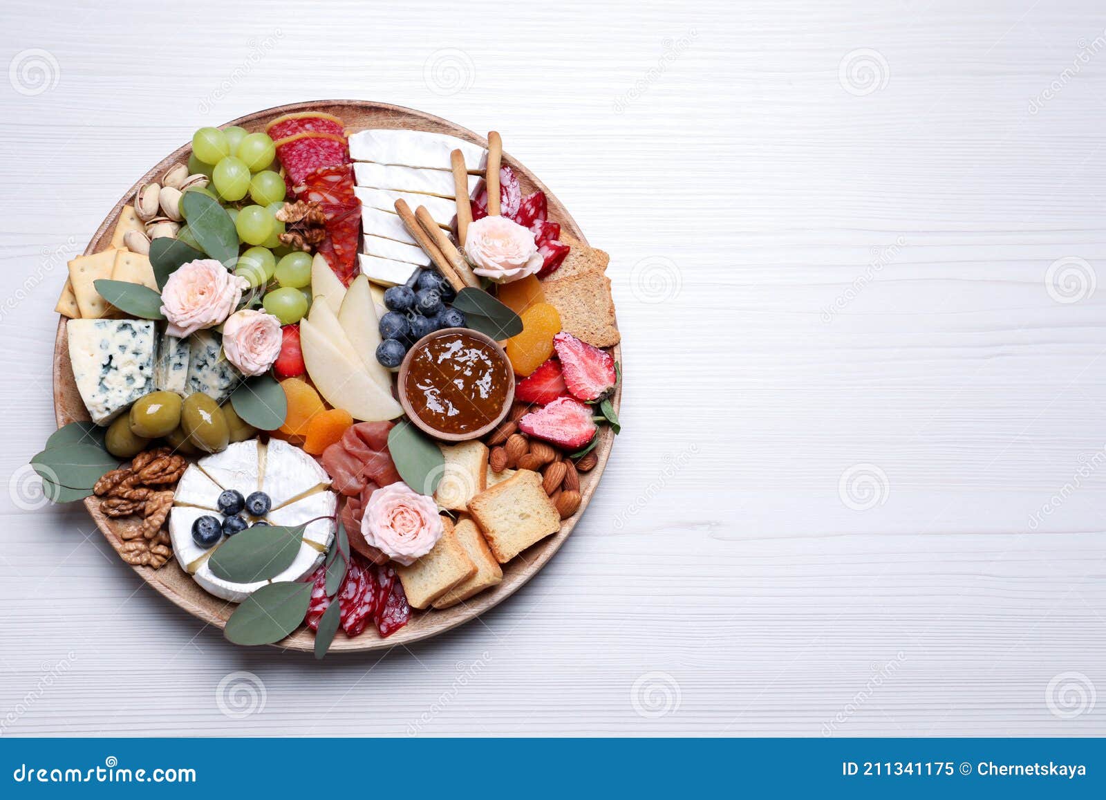 Assorted Appetizer Served on White Wooden Table, Top View. Space for