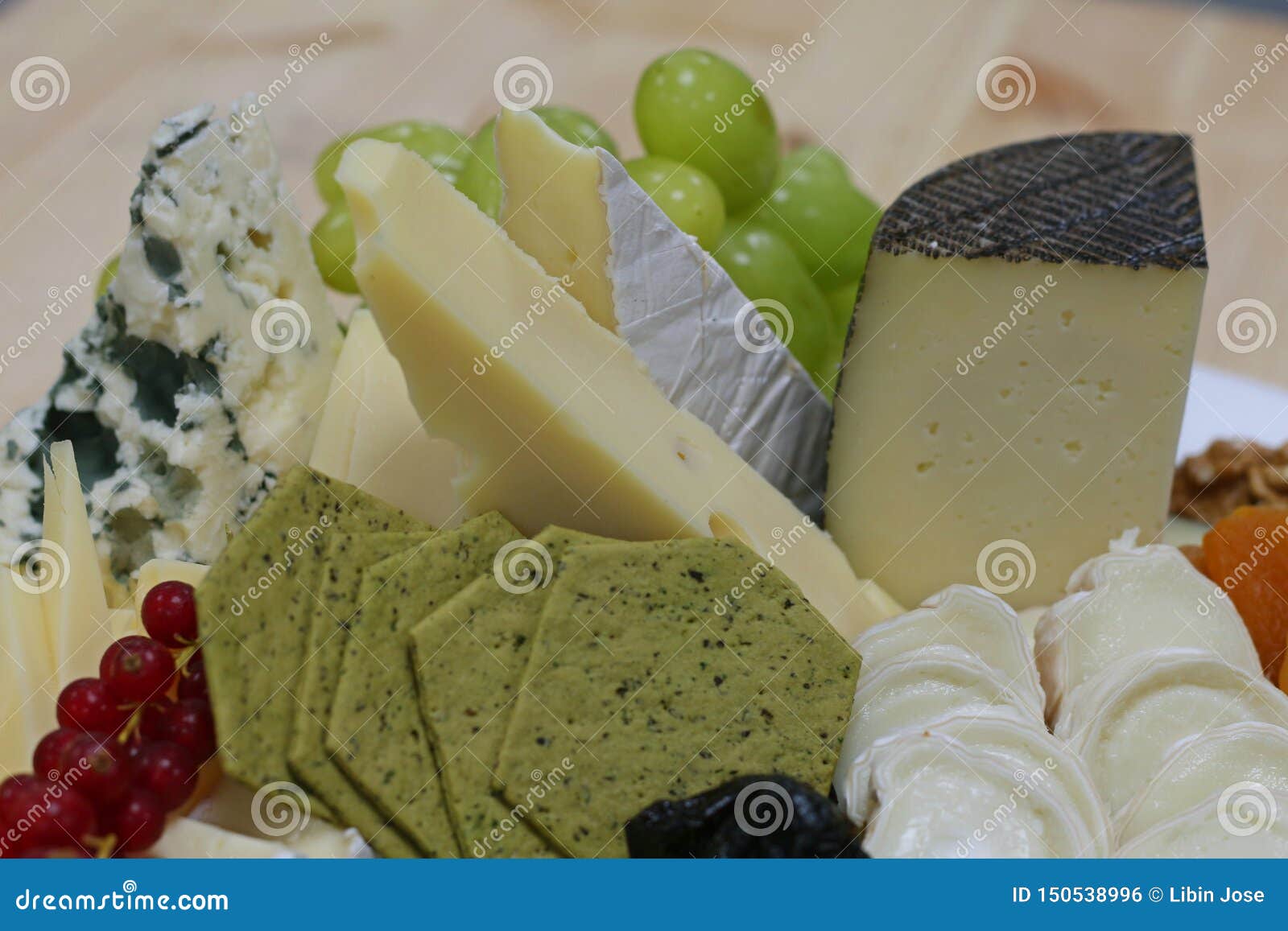 Assorted cheese platter stock photo. Image of grapes 150538996