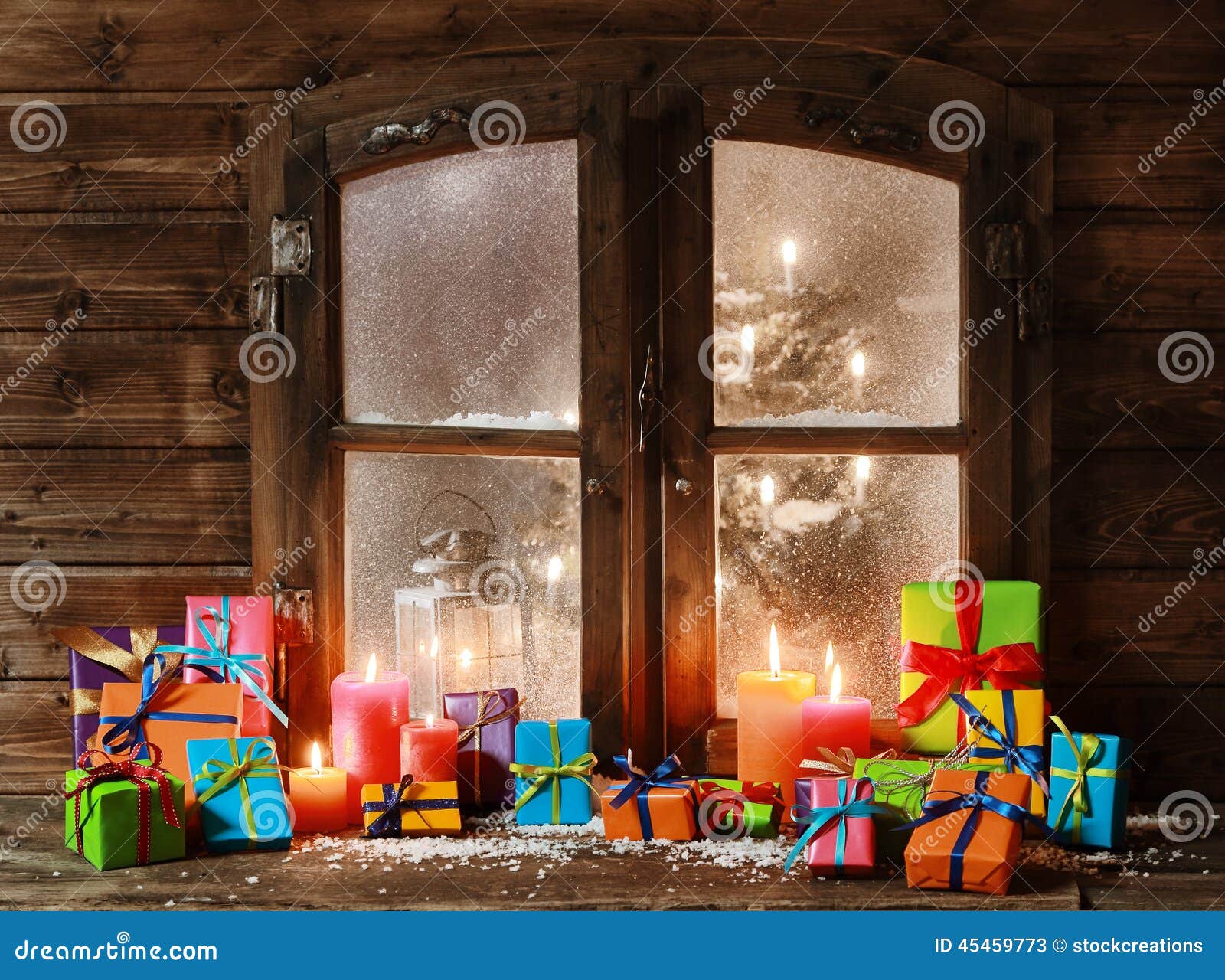 Assorted Christmas Presents and Candles at Window Stock Image - Image ...