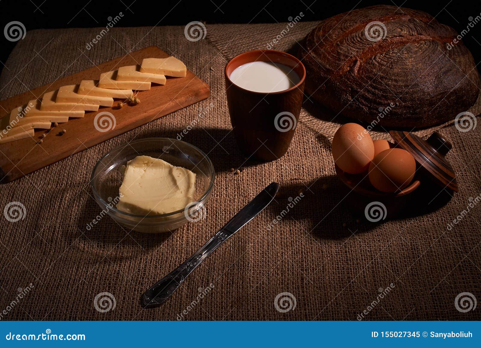 Assorted Dairy Products Milk, Cheese, Eggs. Rustic Still Life on Table