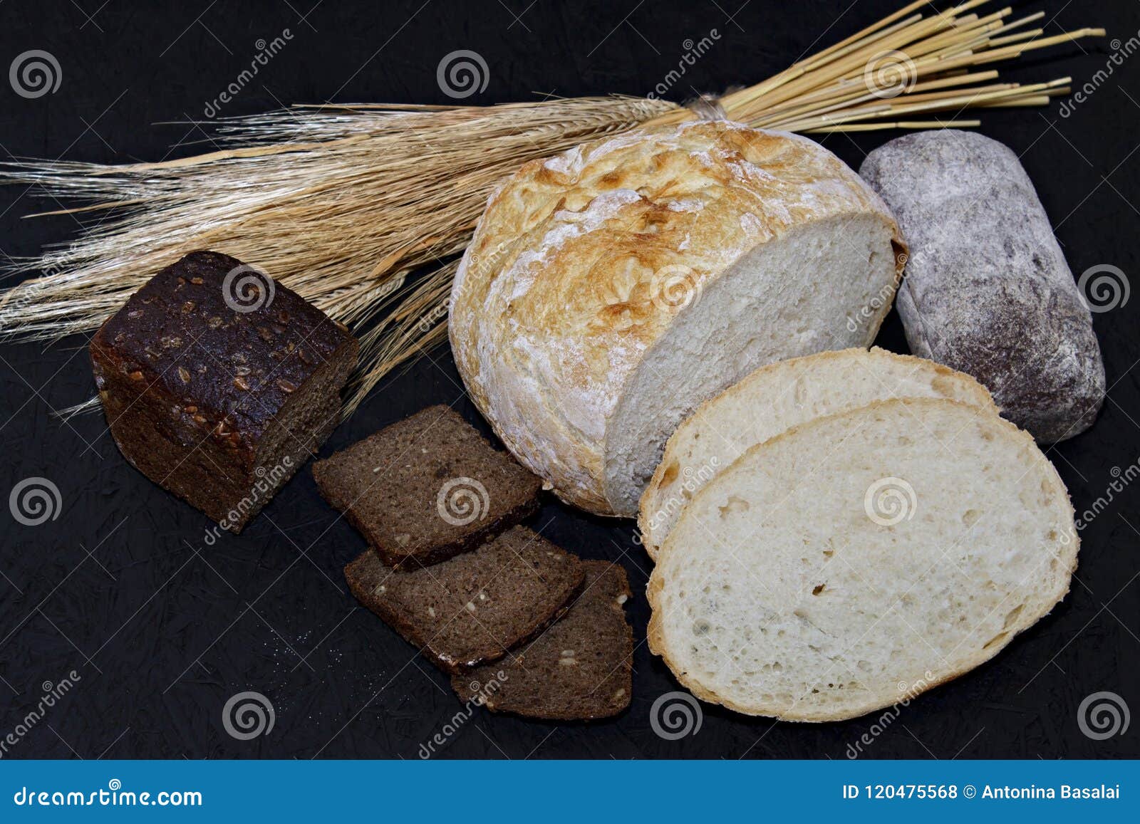 Assorted Different Kinds of White and Black Bread on a Black Background