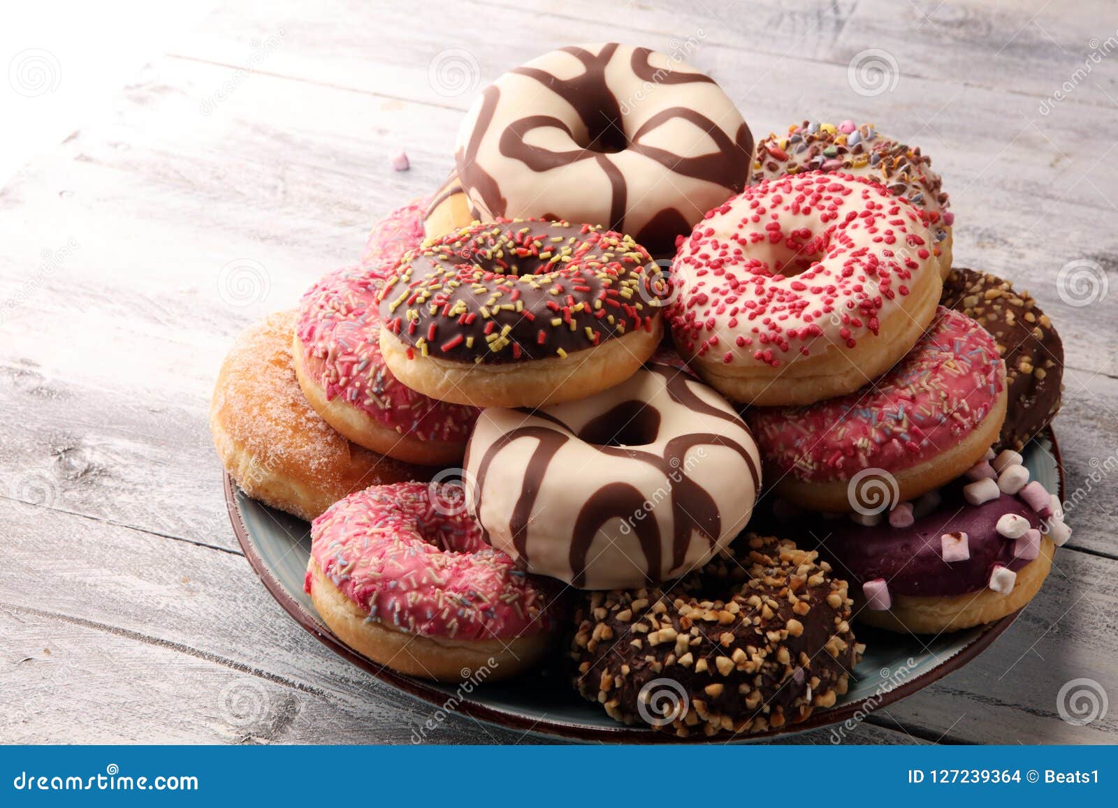 Donuts in different glazes stock photo. Image of baked 127239364