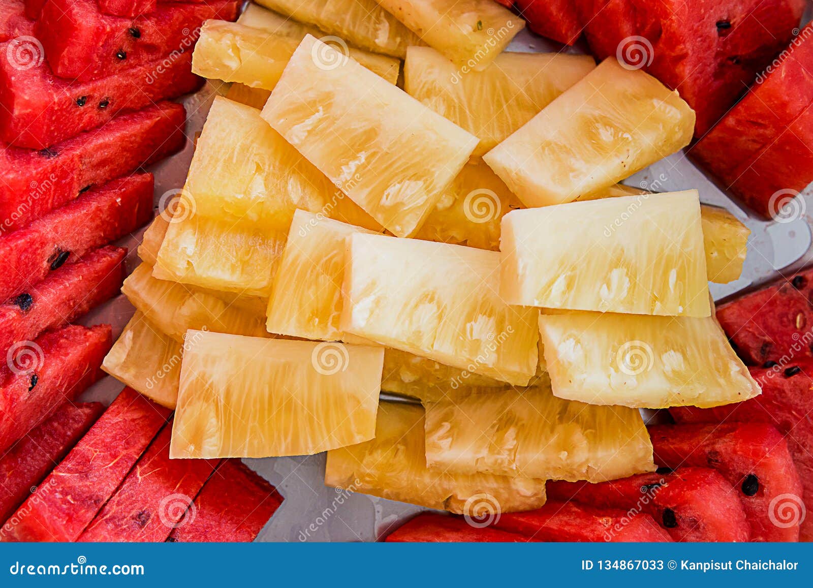 assorted exotic fresh fruits. slide and peice of fresh fruit on white plate.