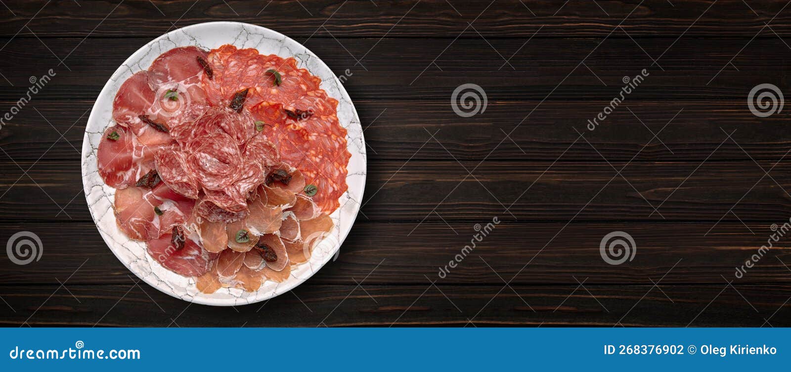 Assorted Meat Cuts, Ham and Sausage, on a Wooden Background Stock Photo