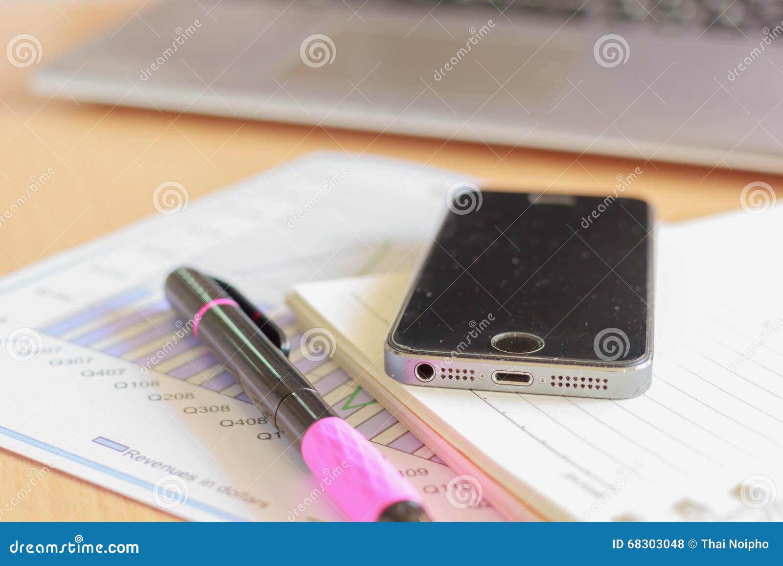 Assorted Office Supplies Such As Mobile, Pen and Diary Stock Photo