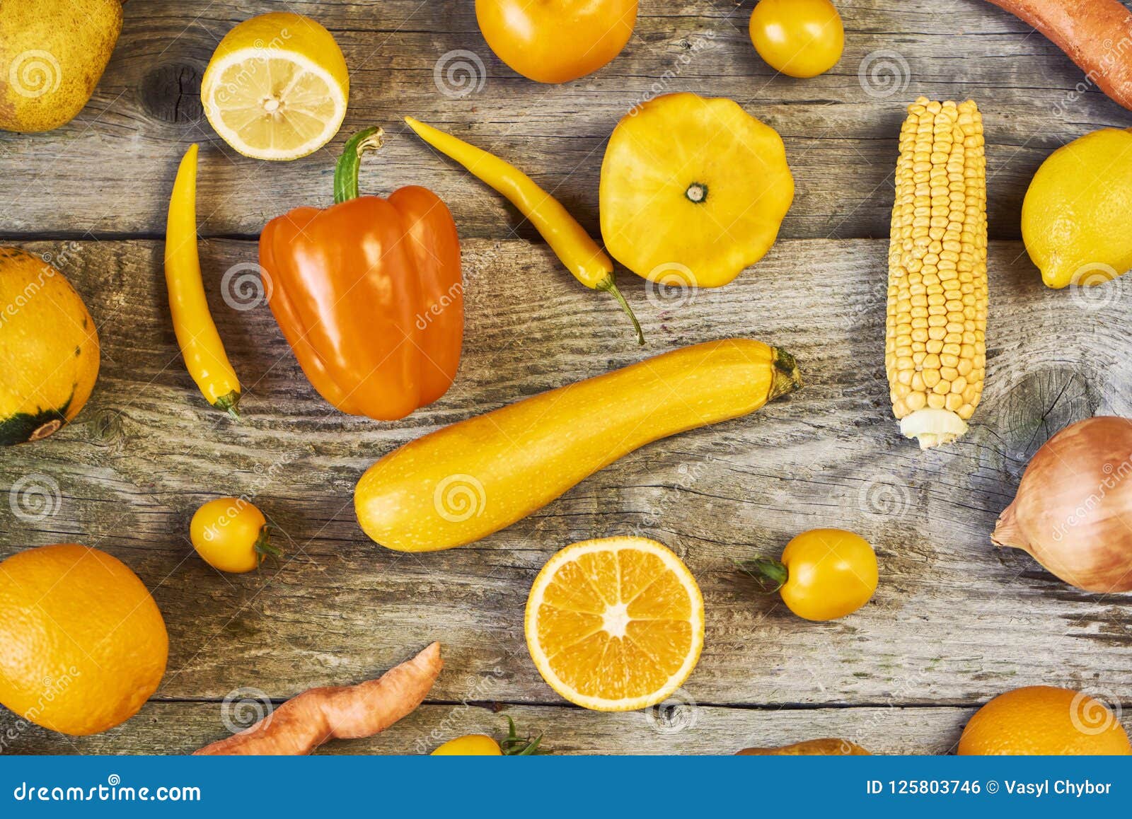 Assorted Types Of Yellow Fruits And Vegetables On Wooden Background ...