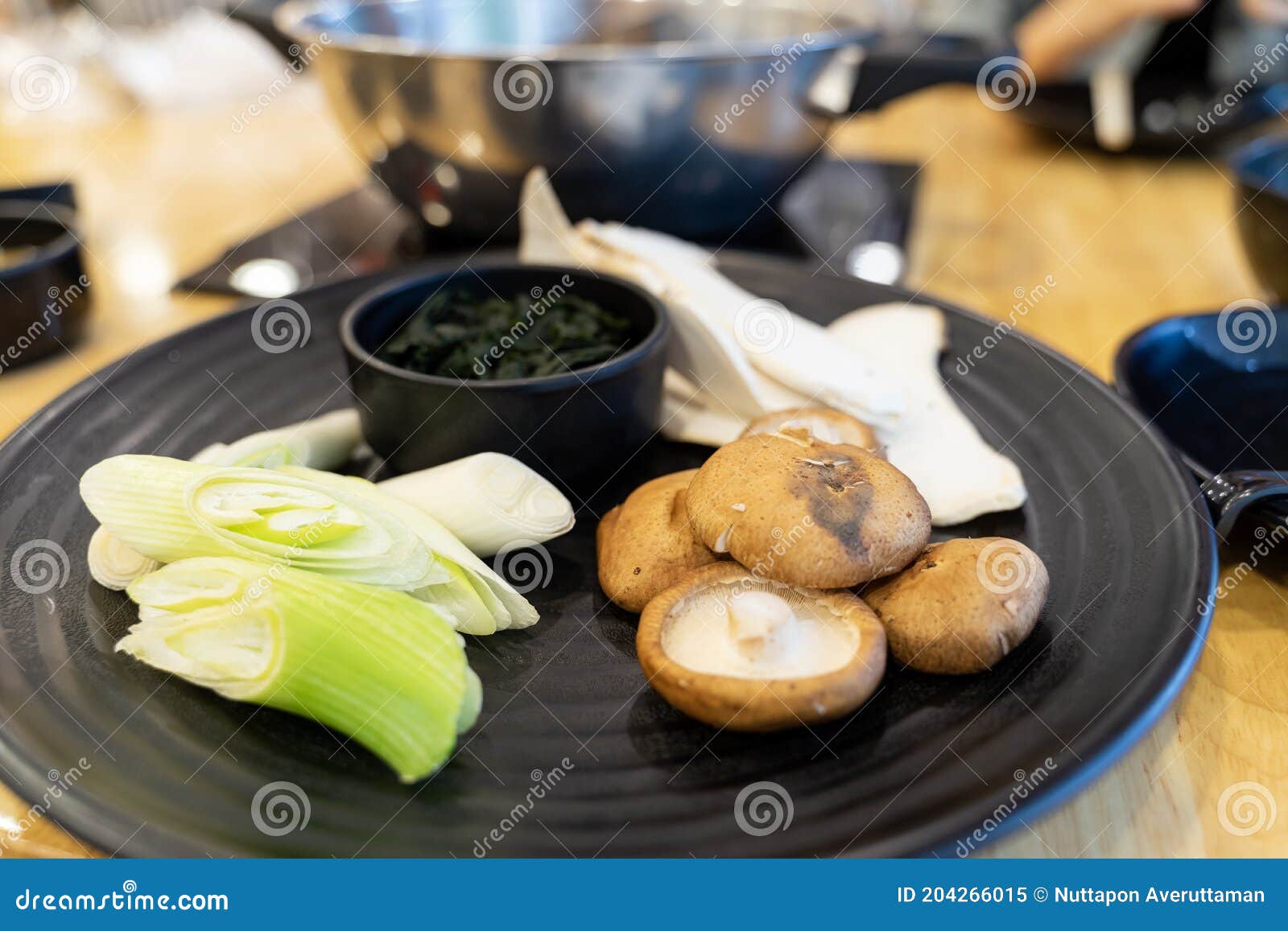 Vegetables and Mushrooms on a Black Plate for Hot Pot Stock Image