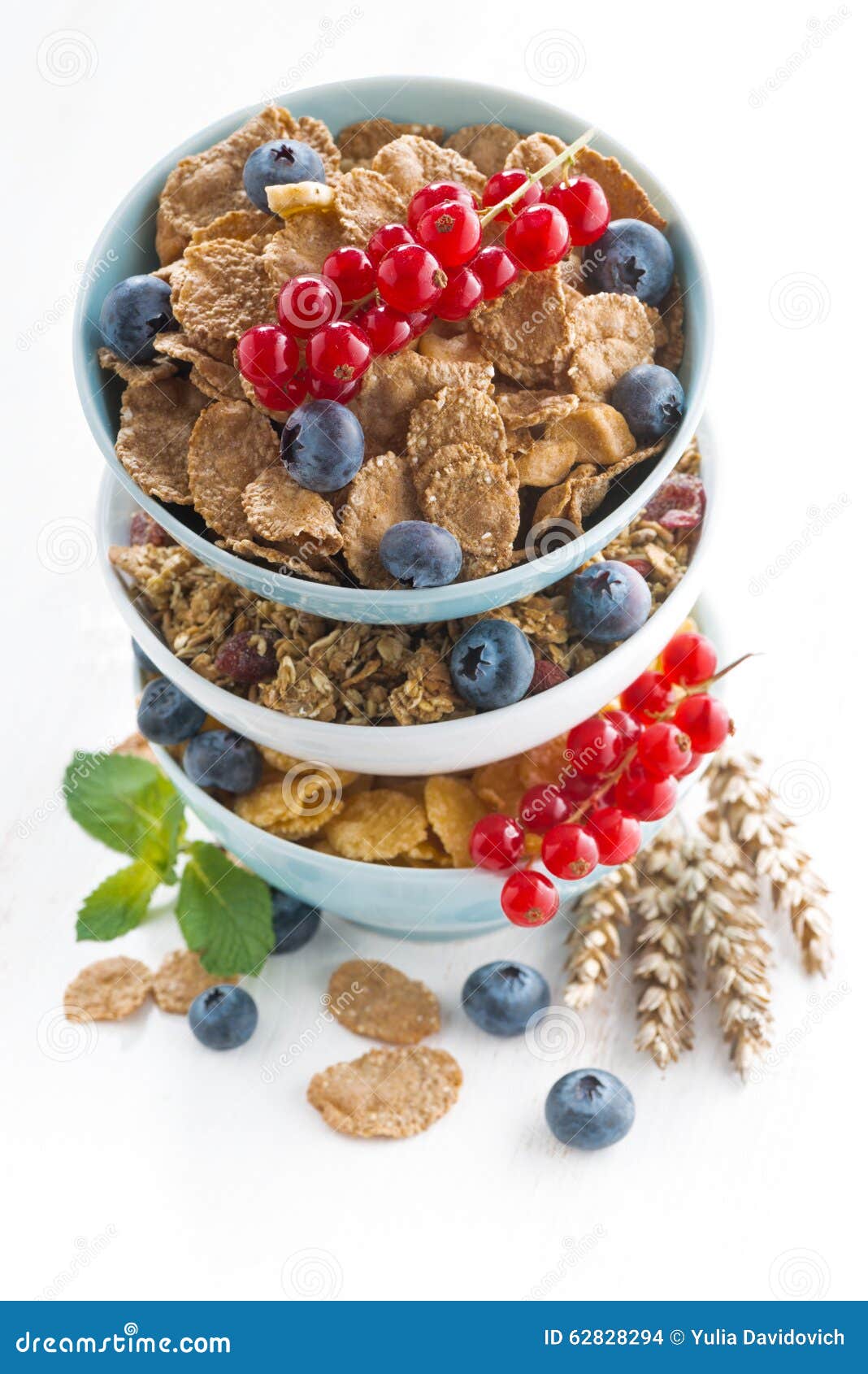 Assortment of Breakfast Cereal and Fresh Berries, Vertical Stock Photo