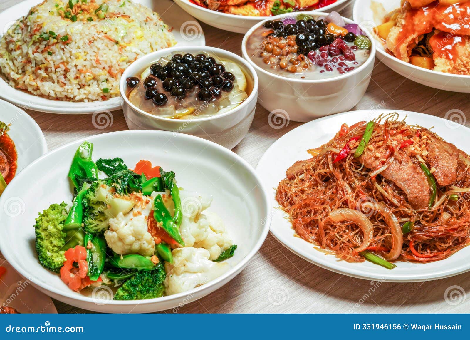 assortment chinese cuisine, egg fried rice, sauteed pork liver, mix vegetables, stir fried rice vermicelli, sweet sour fish fillet